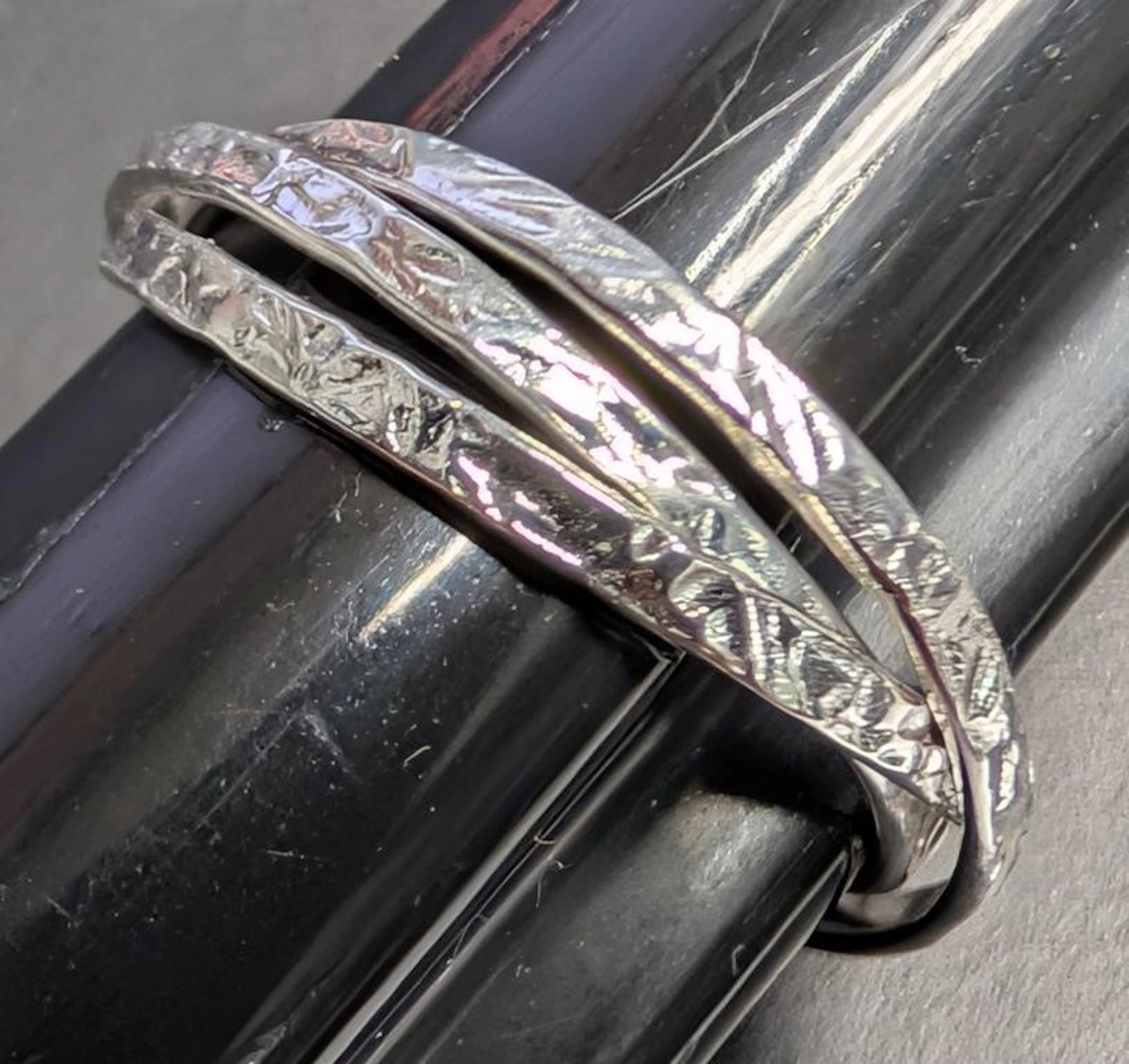 $50, silver (1.5g), three ring, size 6, retail val