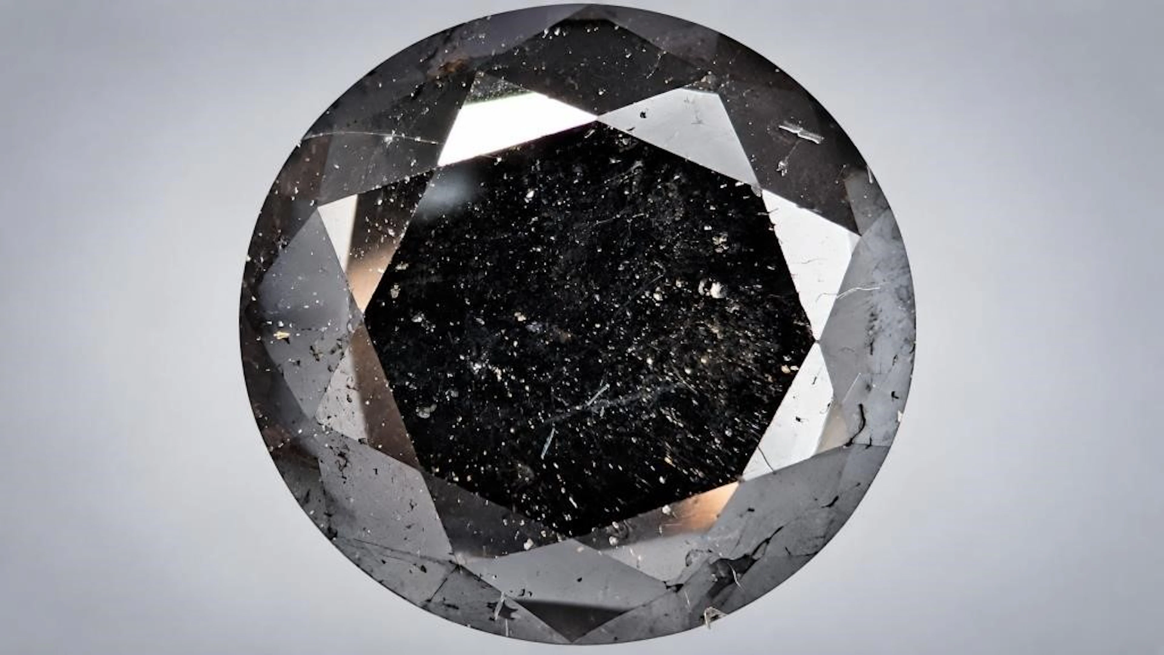 $2000, black diamond (5.3ct)gemstone, retail value