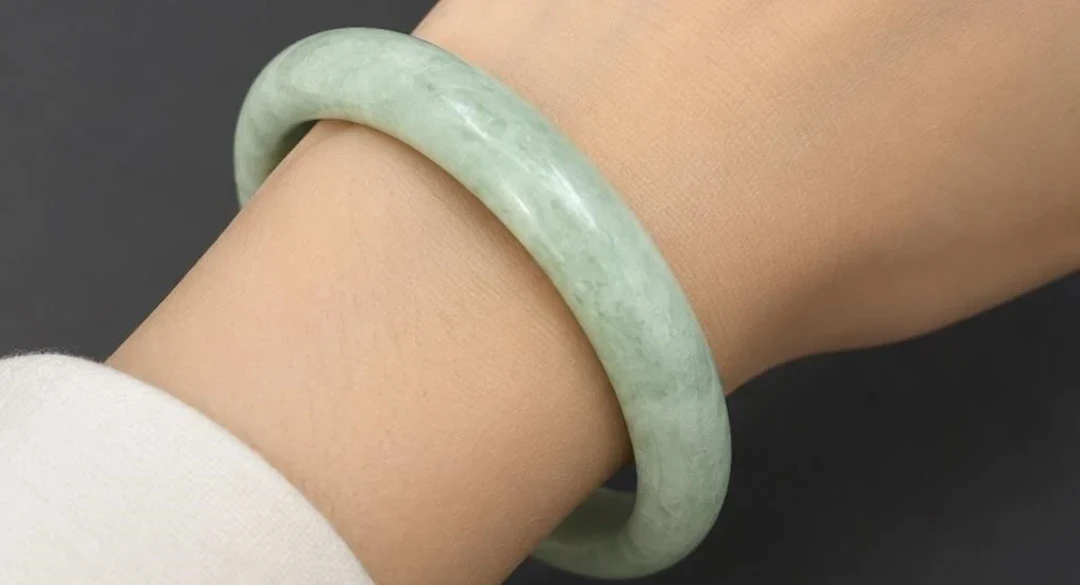 $200, natural green jadeite bangle, retail value