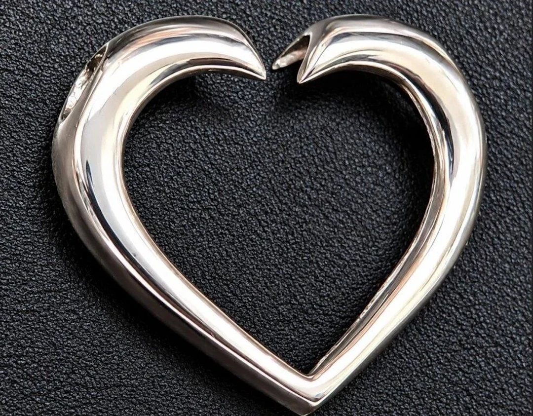 $40, silver heart shape pendant, retail value $40