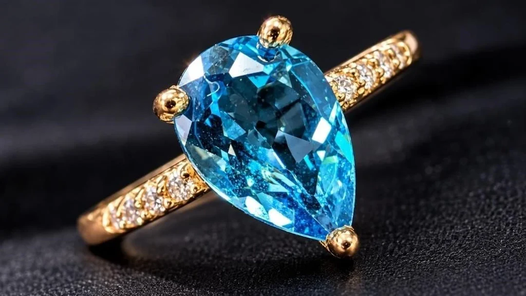 $2200, 10K(1.4g), blue topaz (1.2ct), diamond (0.0