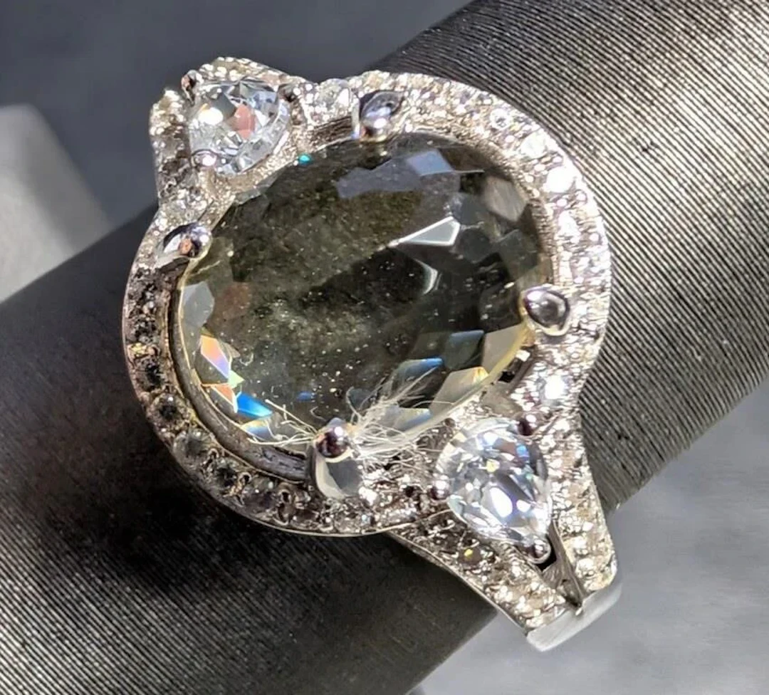 $320, silver(5.53g), cz ring, size 9, retail value
