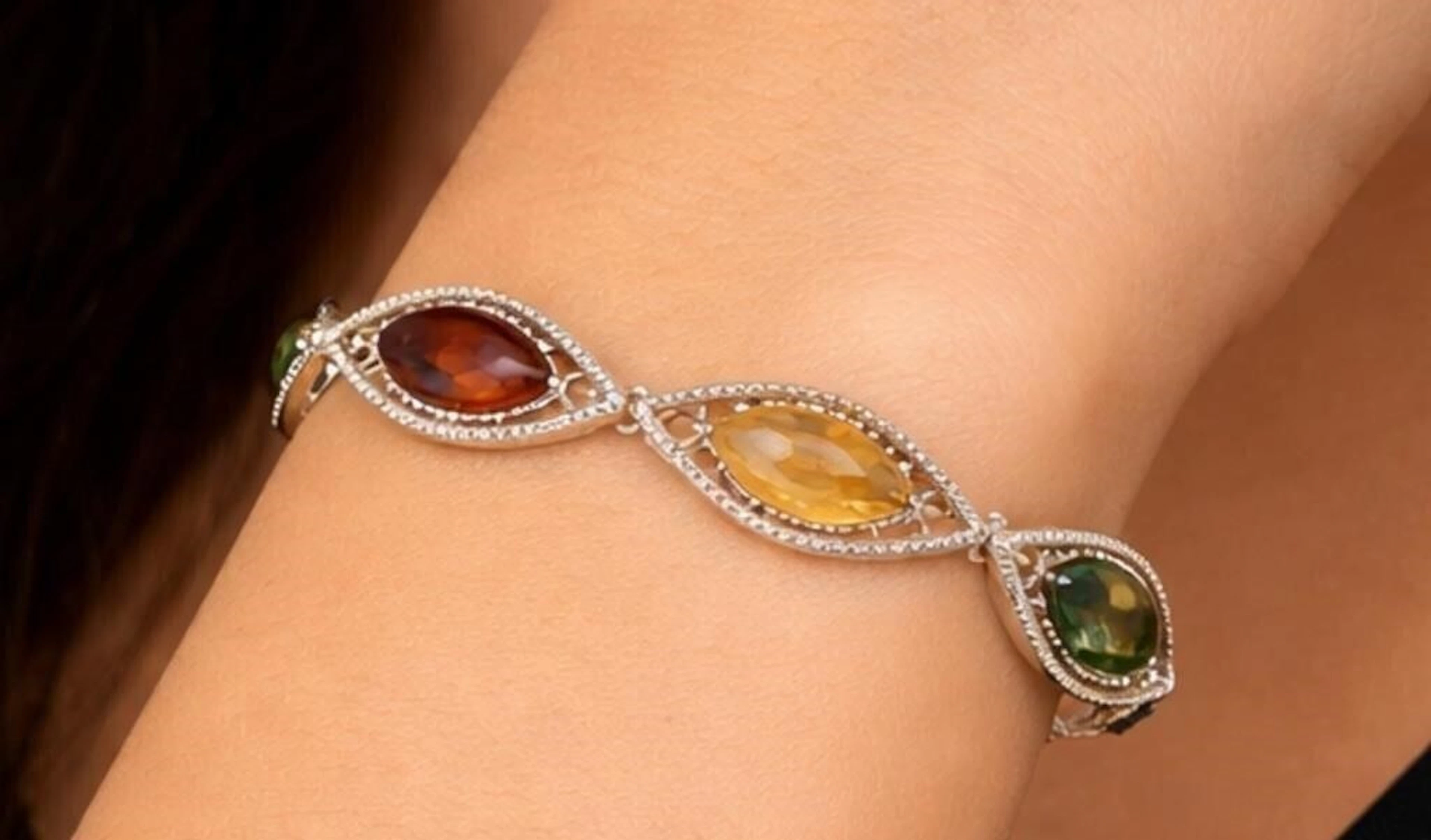 $660, silver(10.38g), amber bracelet 7", MSRP $6