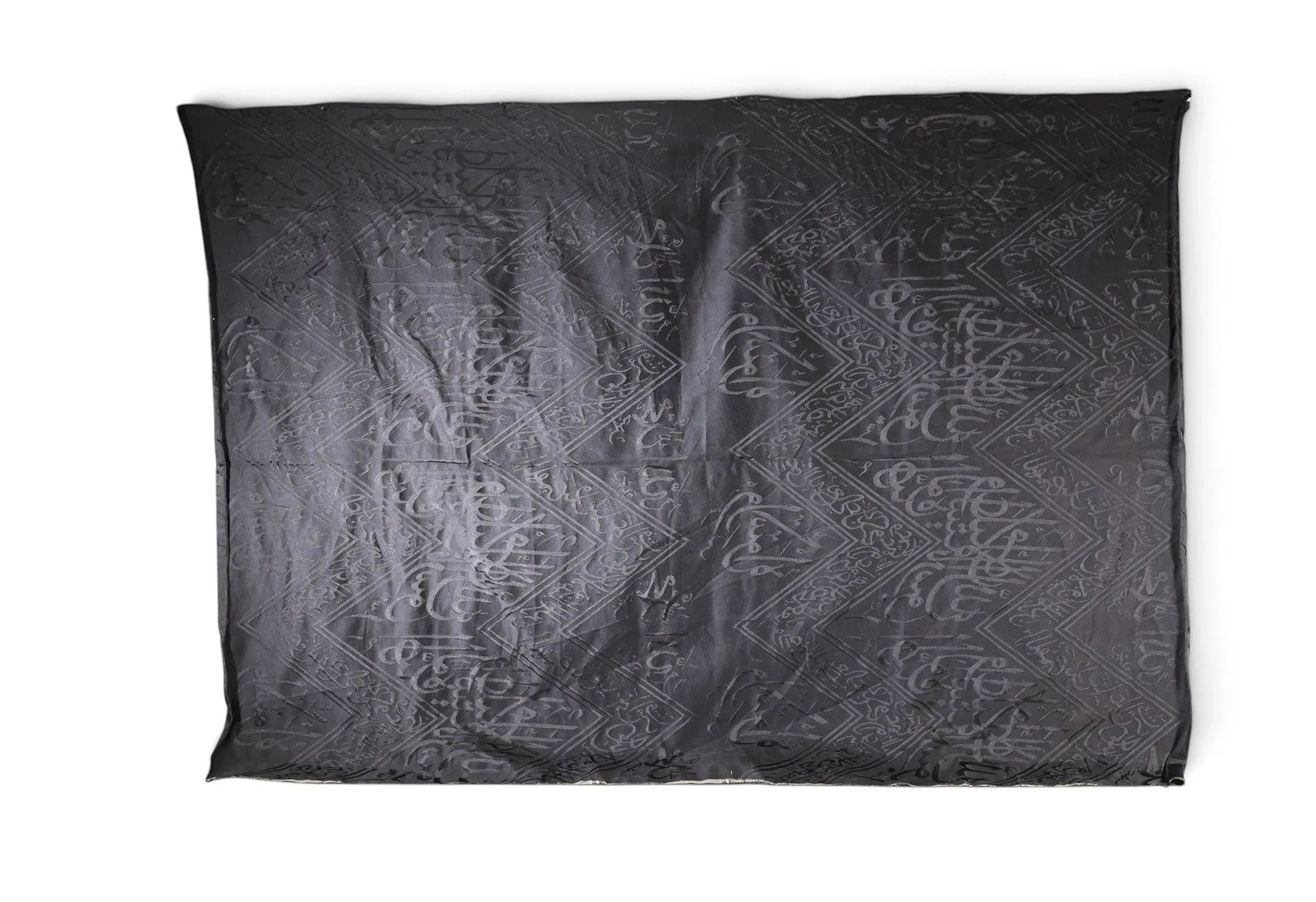 FRAGMENT OF BLACK KISWAH FABRIC FROM THE KA‘BA, SAUDI ARABIA - Lot 119