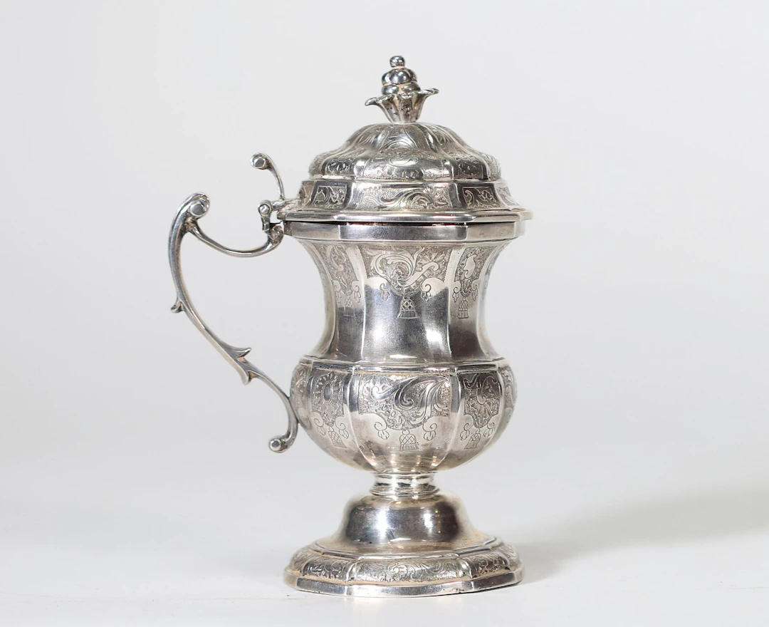 Solid silver baluster-shaped mustard pot resting on a molded - Lot 47