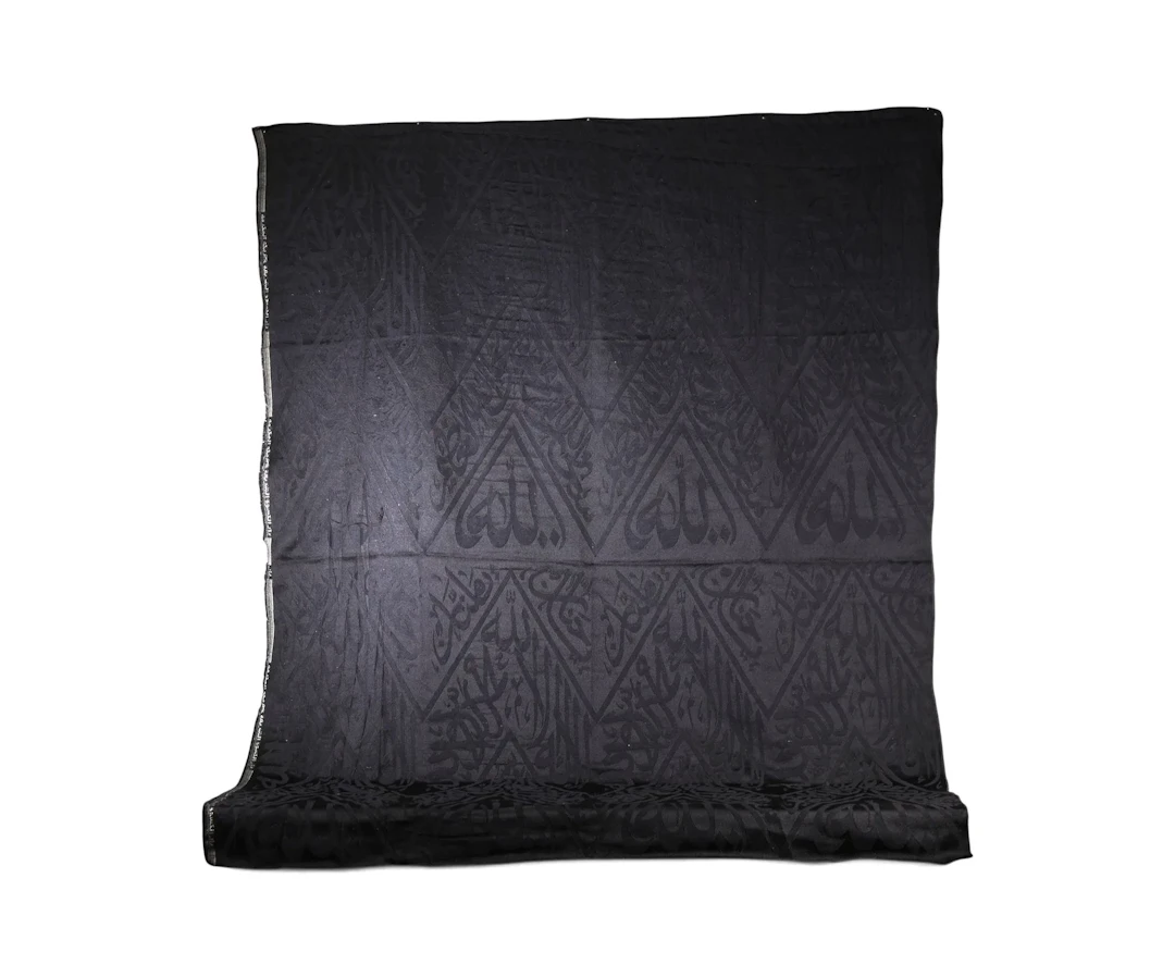BLACK CALLIGRAPHIC TEXTILE FRAGMENT FROM KISWAH, SAUDI ARABI - Lot 117