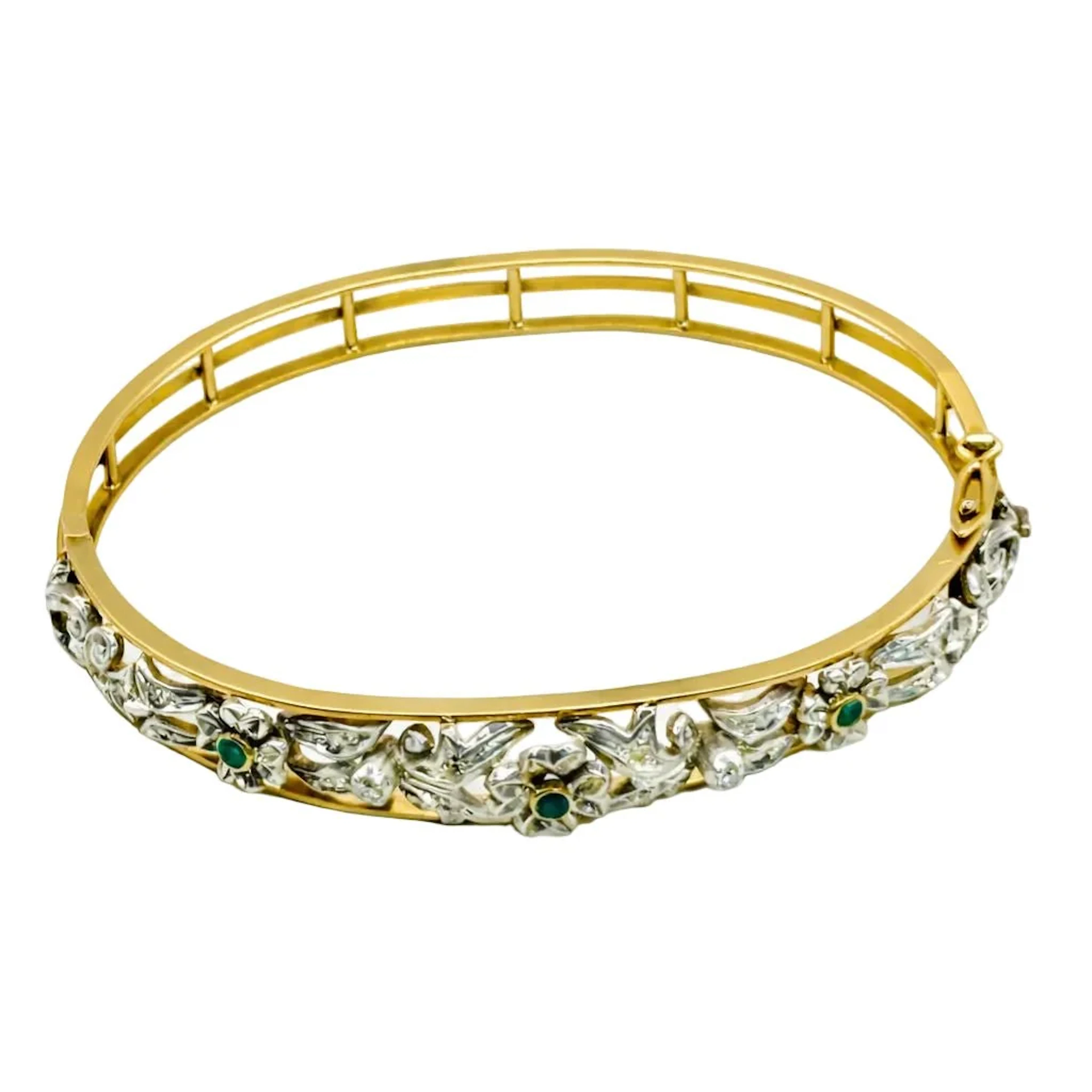 Yellow gold, silver, emerald, and diamond bangle bracelet