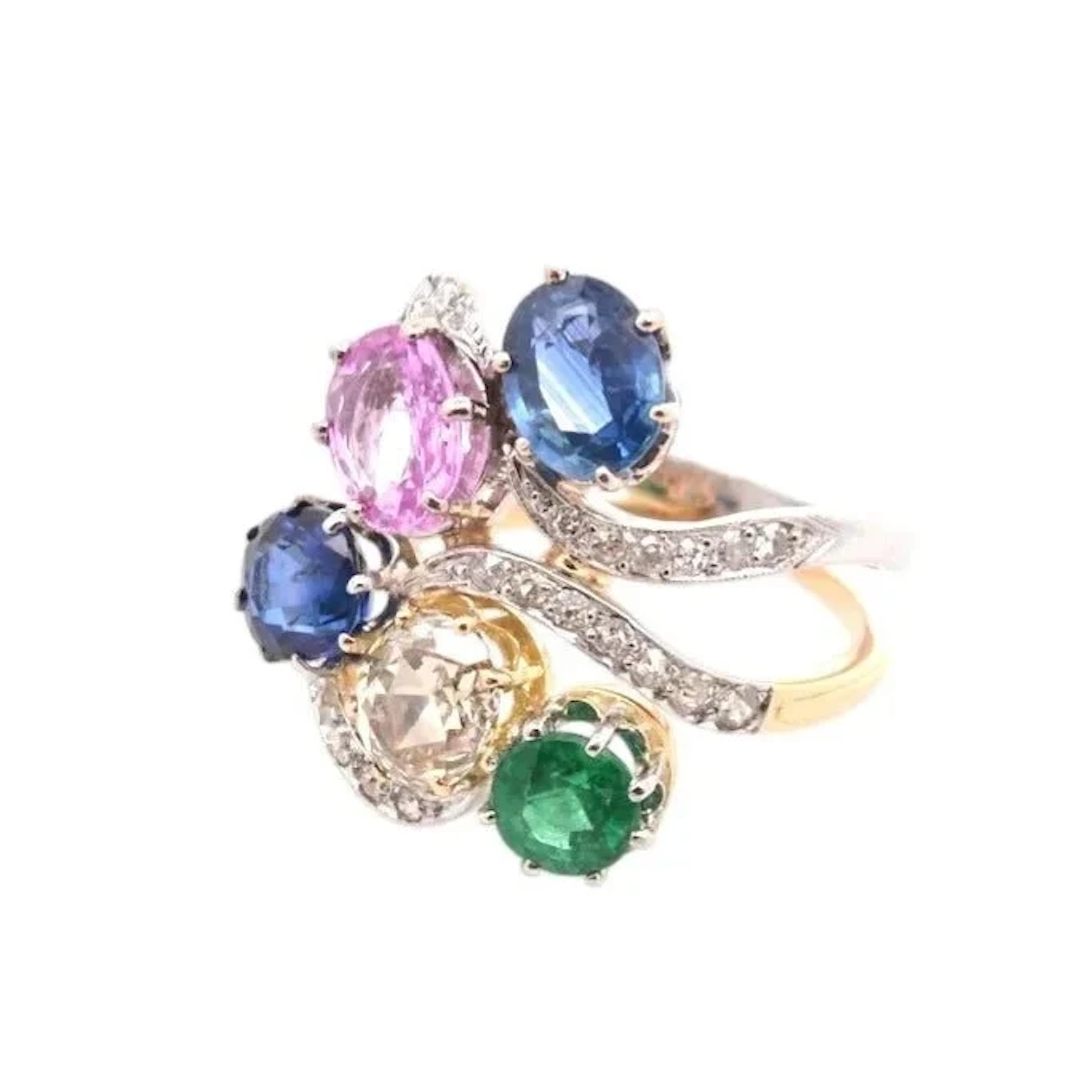 Ring in yellow gold, platinum, sapphires, emeralds, and diamonds