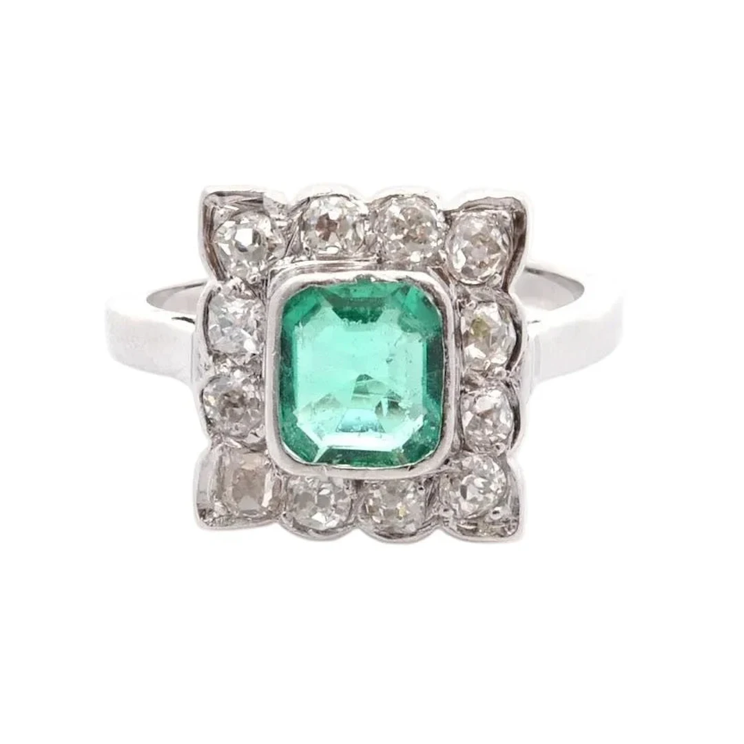 "Entourage" Ring in White Gold, Emerald, and Diamonds