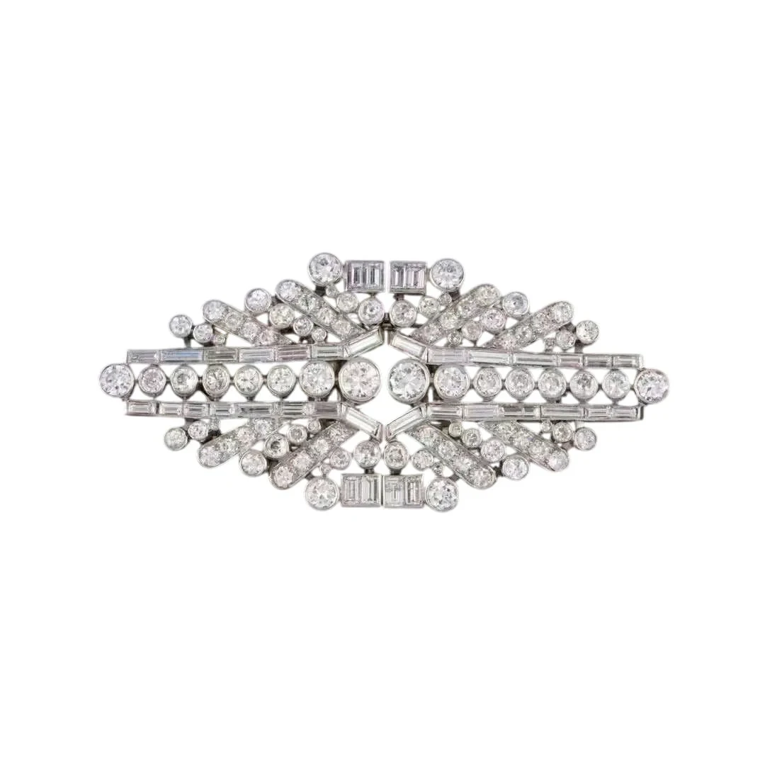 Double clip brooches in white gold, platinum, and diamonds