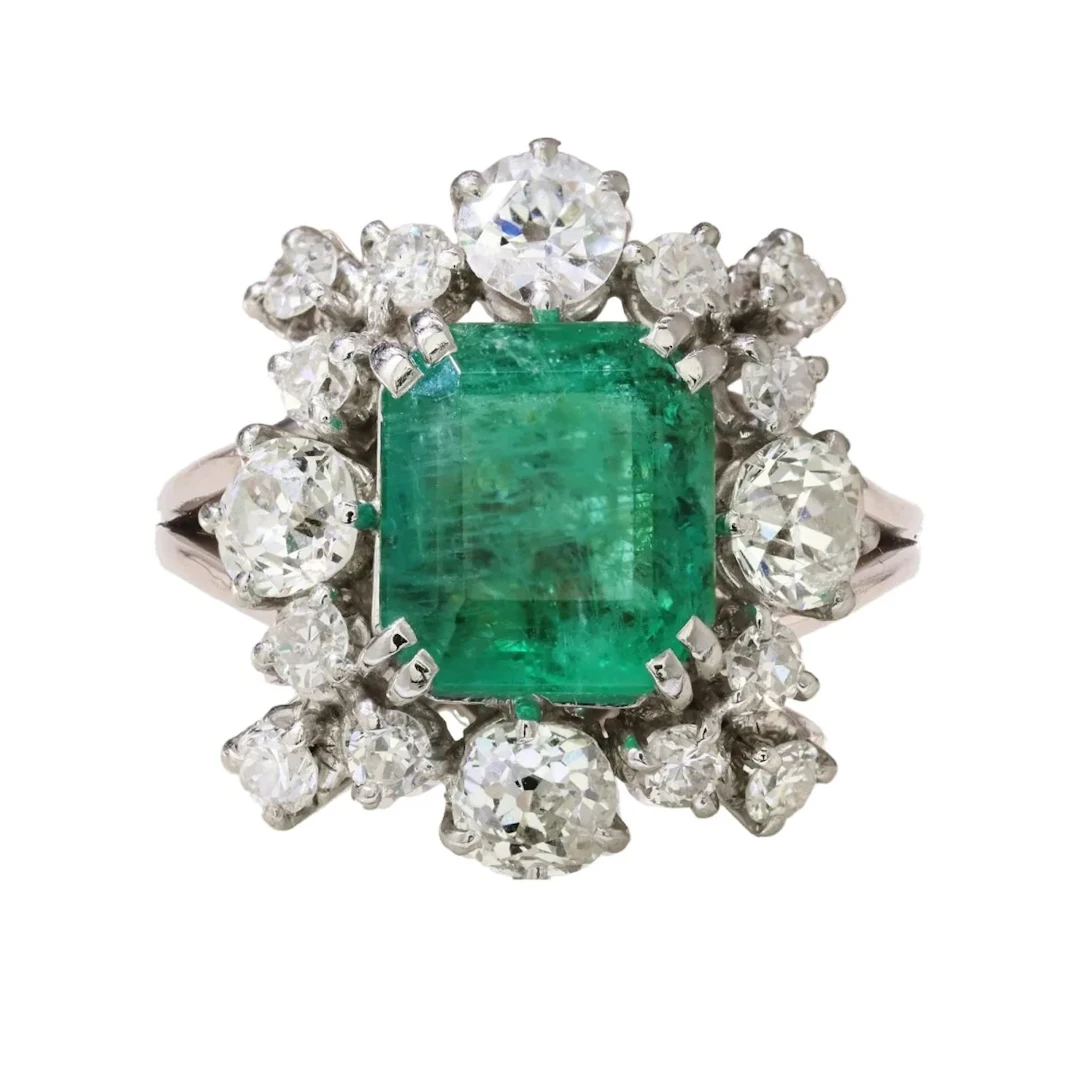 Ring Surroundings in white gold, paltinium, emerald and diamonds