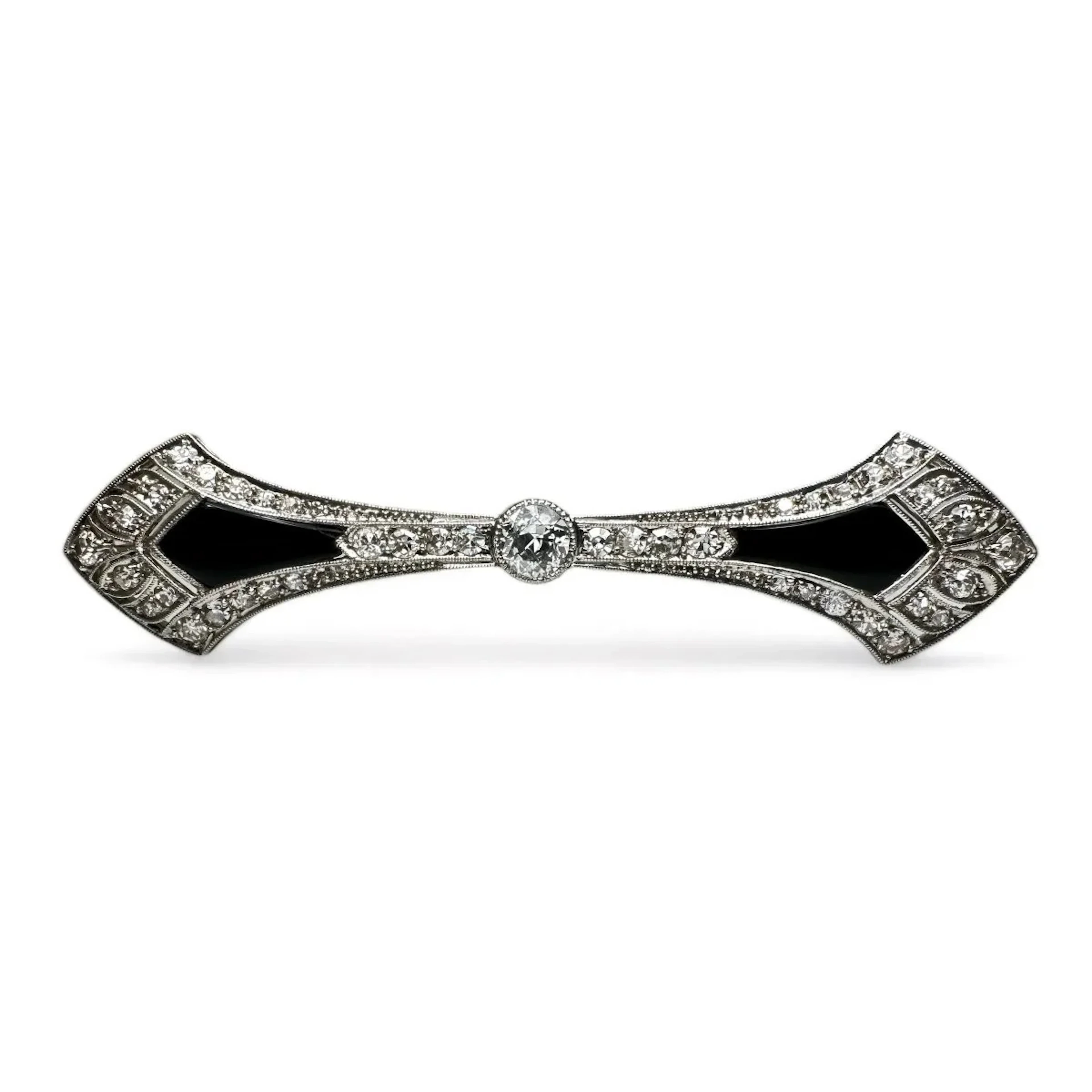 Art Deco barrette brooch in platinum, diamonds and onyx.