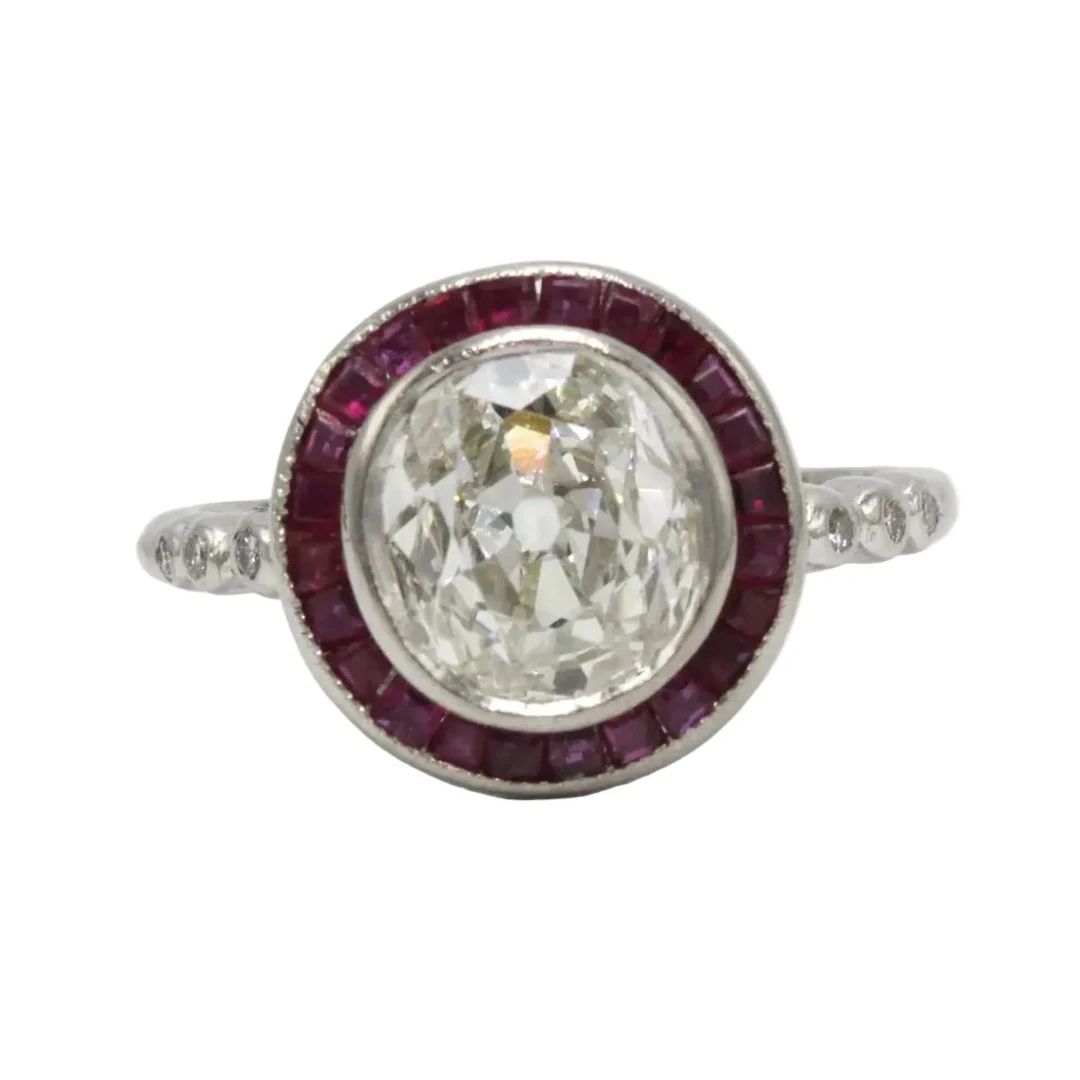 Entourage Ring in platinum, rubies, and diamonds