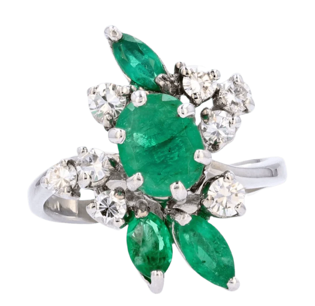 Cocktail ring in white gold, emeralds and diamonds