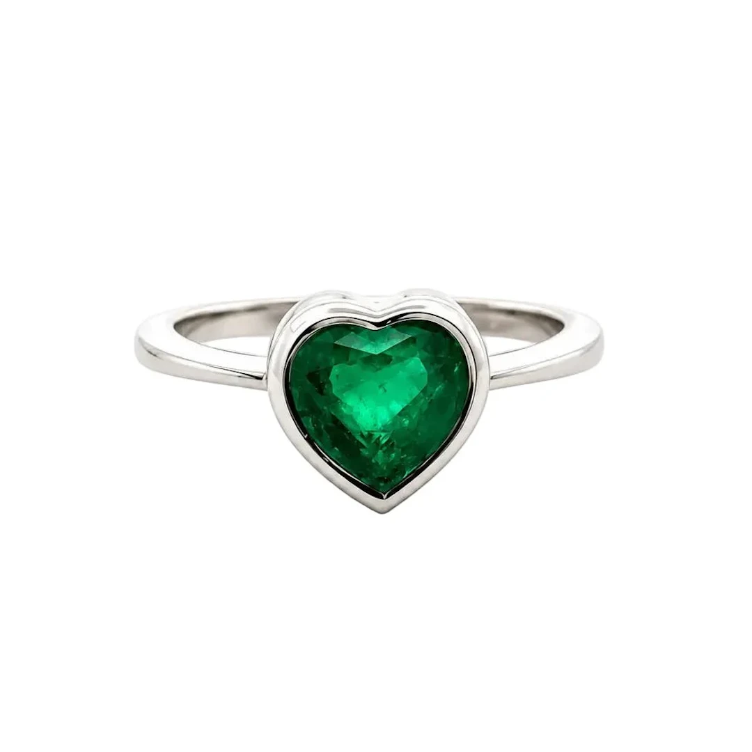 White Gold Solitaire Ring with an Emerald