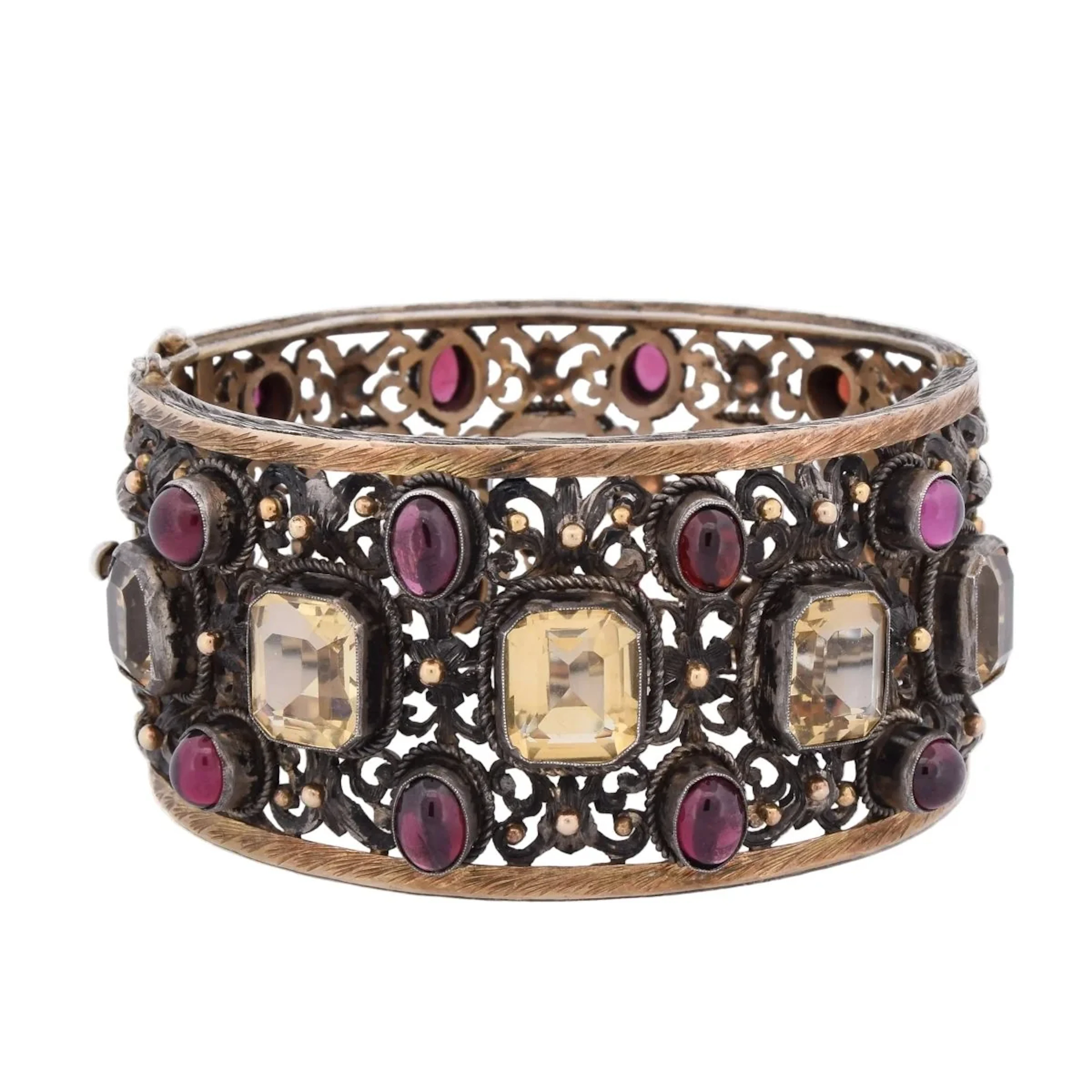 Cuff bracelet in yellow gold, silver, beryls, and garnets