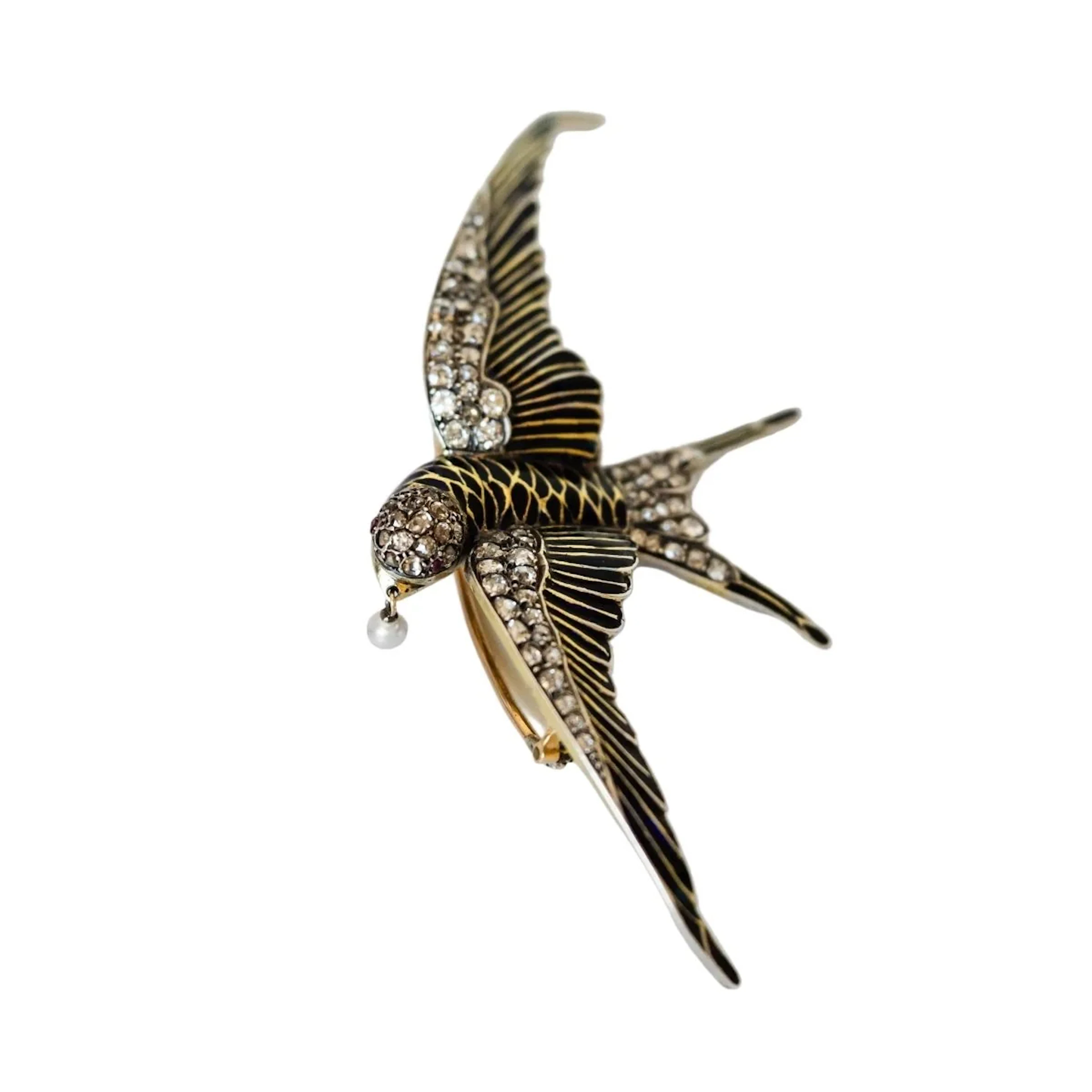 Brooch "swallow" in yellow gold and silver