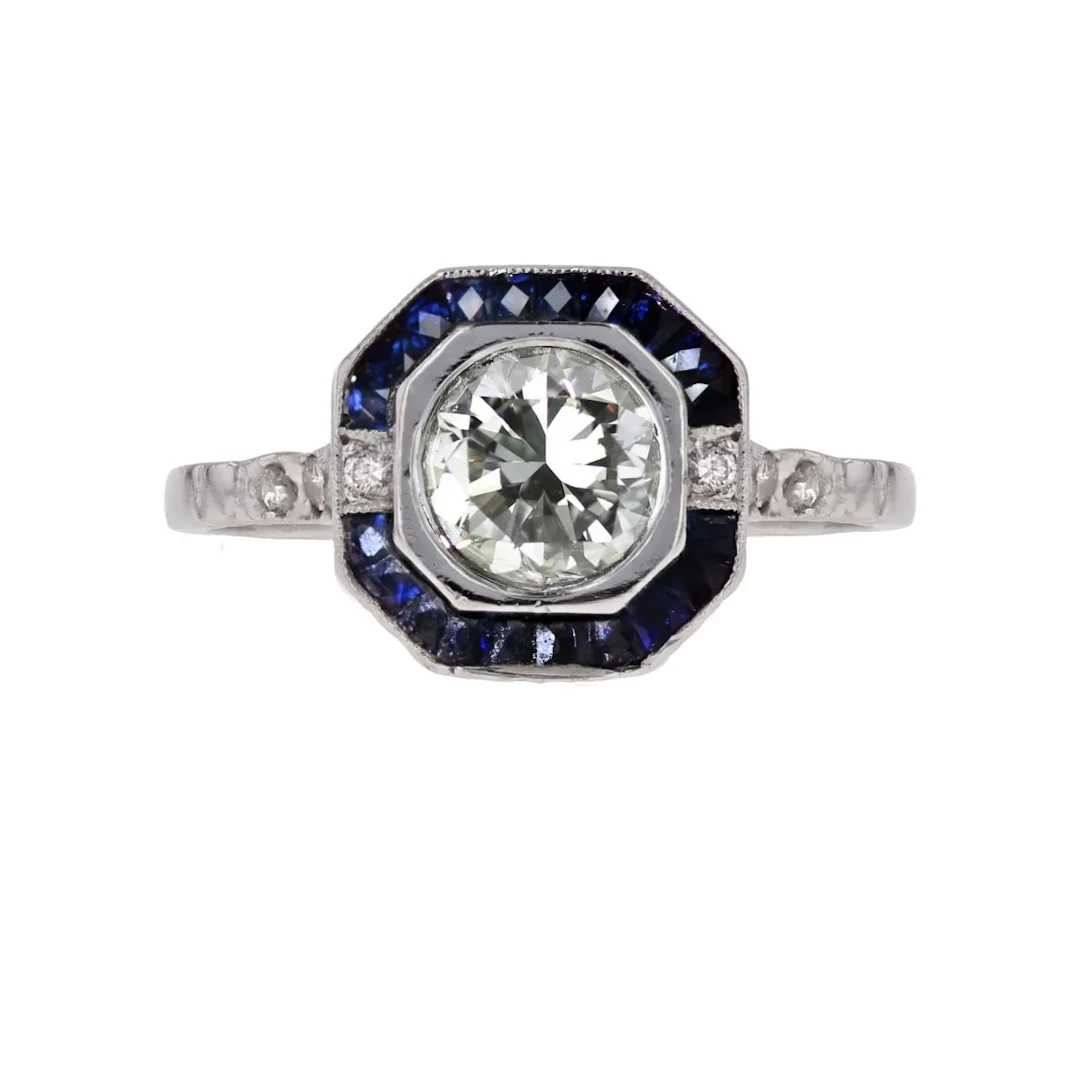 Entourage ring in platinum, sapphires and diamonds