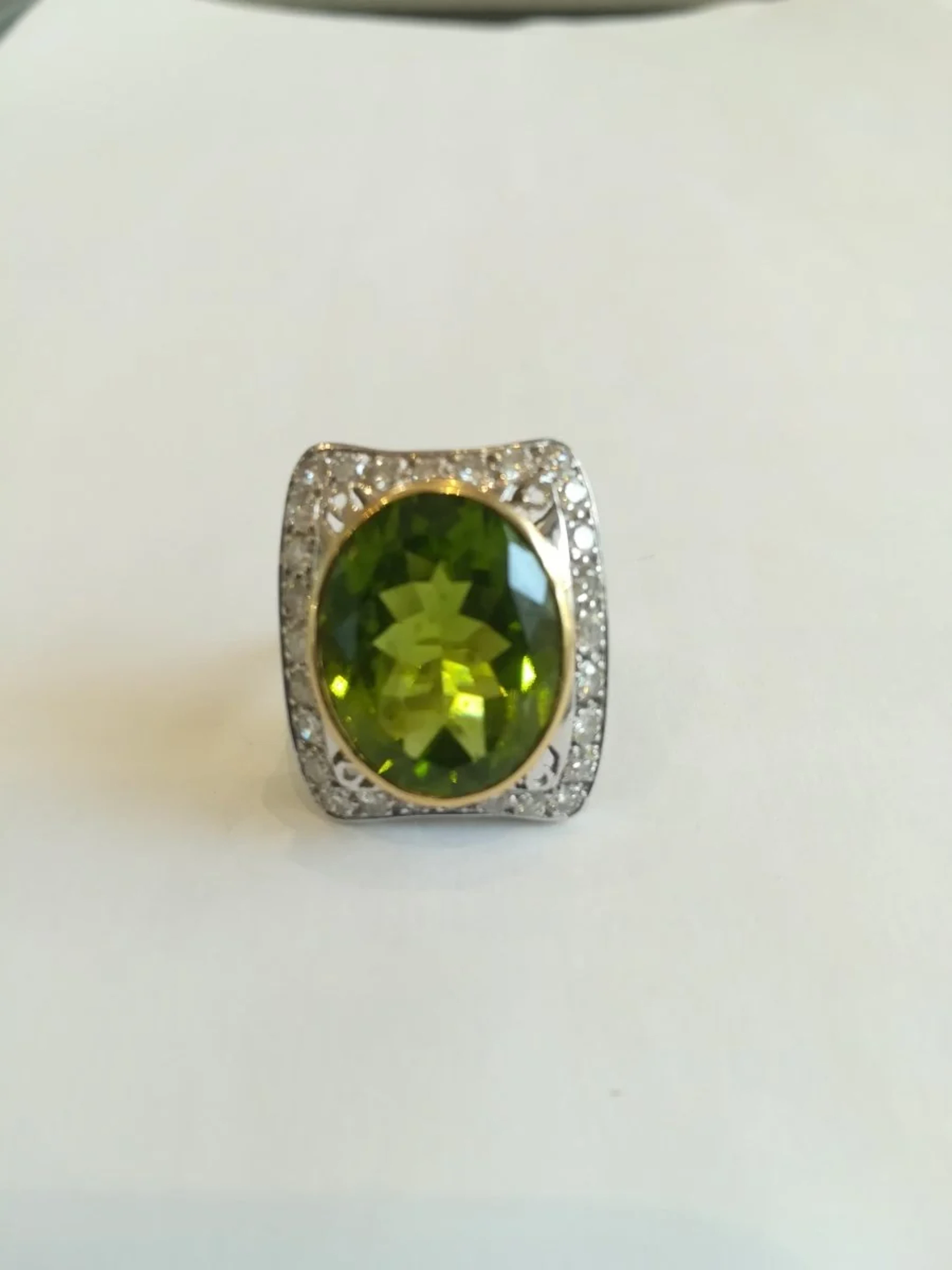 Ring in multicolored gold, Peridot, and Diamonds