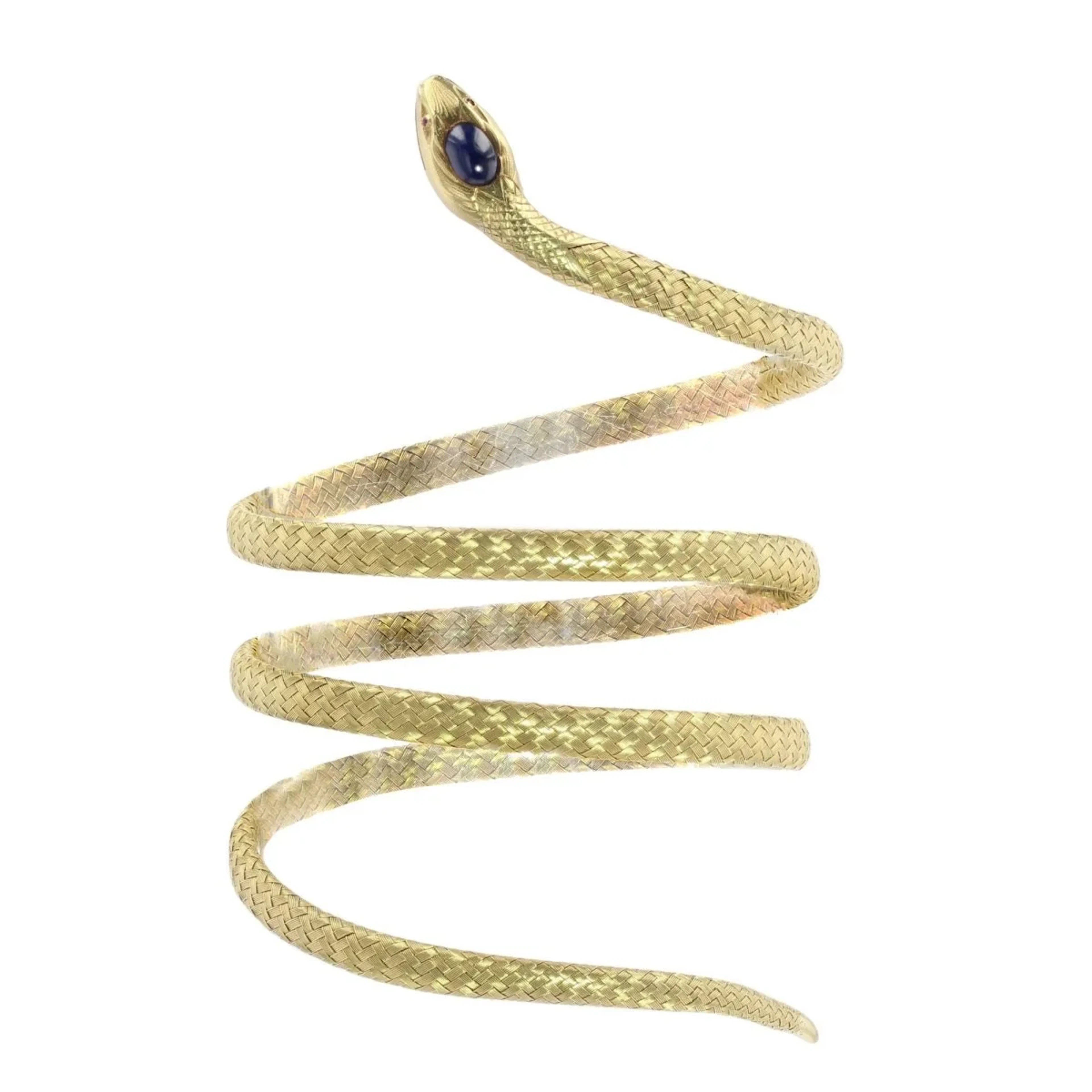 Flexible bracelet in yellow gold, rubies, and sapphires