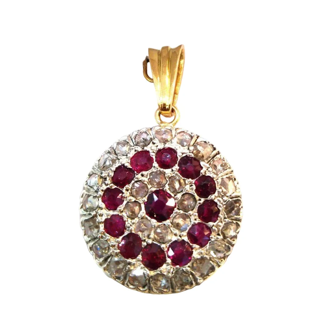 Pendant made of yellow gold, silver, rubies, and diamonds