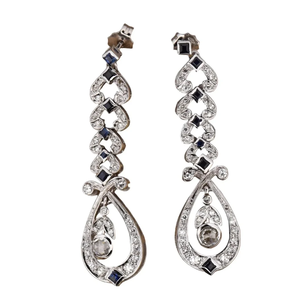 Dangling earrings in white gold, sapphires and diamonds