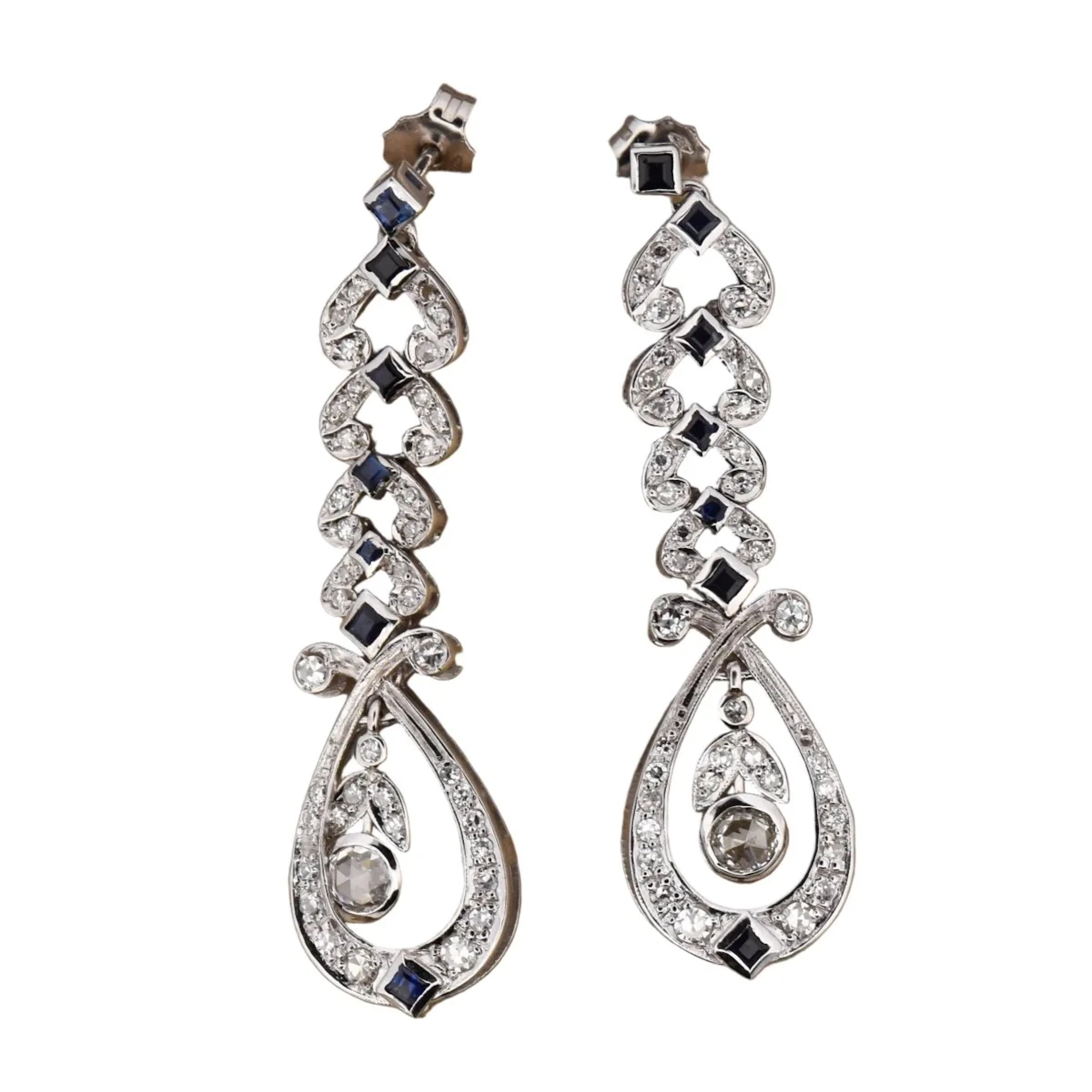 Dangling earrings in white gold, sapphires and diamonds