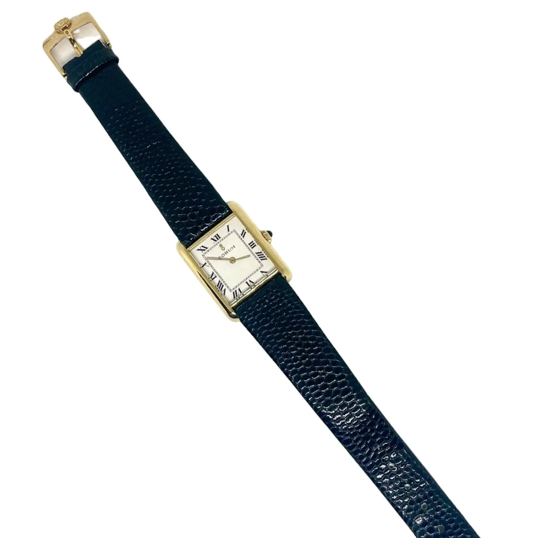 CORUM "Tank" watch in yellow gold and leather