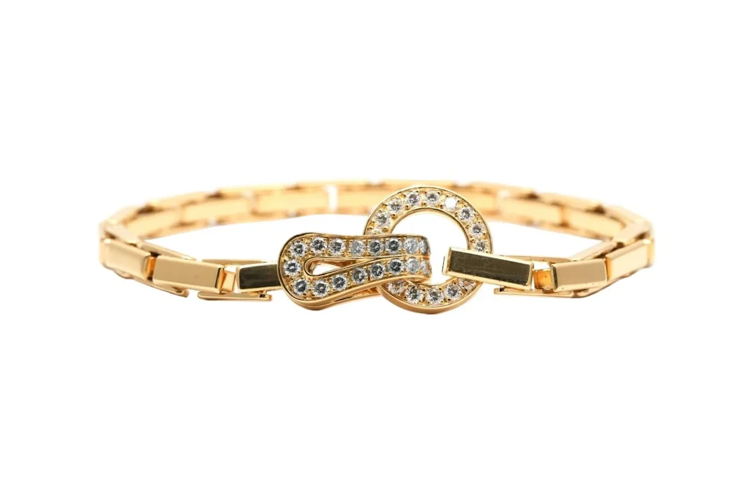 CARTIER "Agrafe" Link Bracelet in yellow gold and diamonds