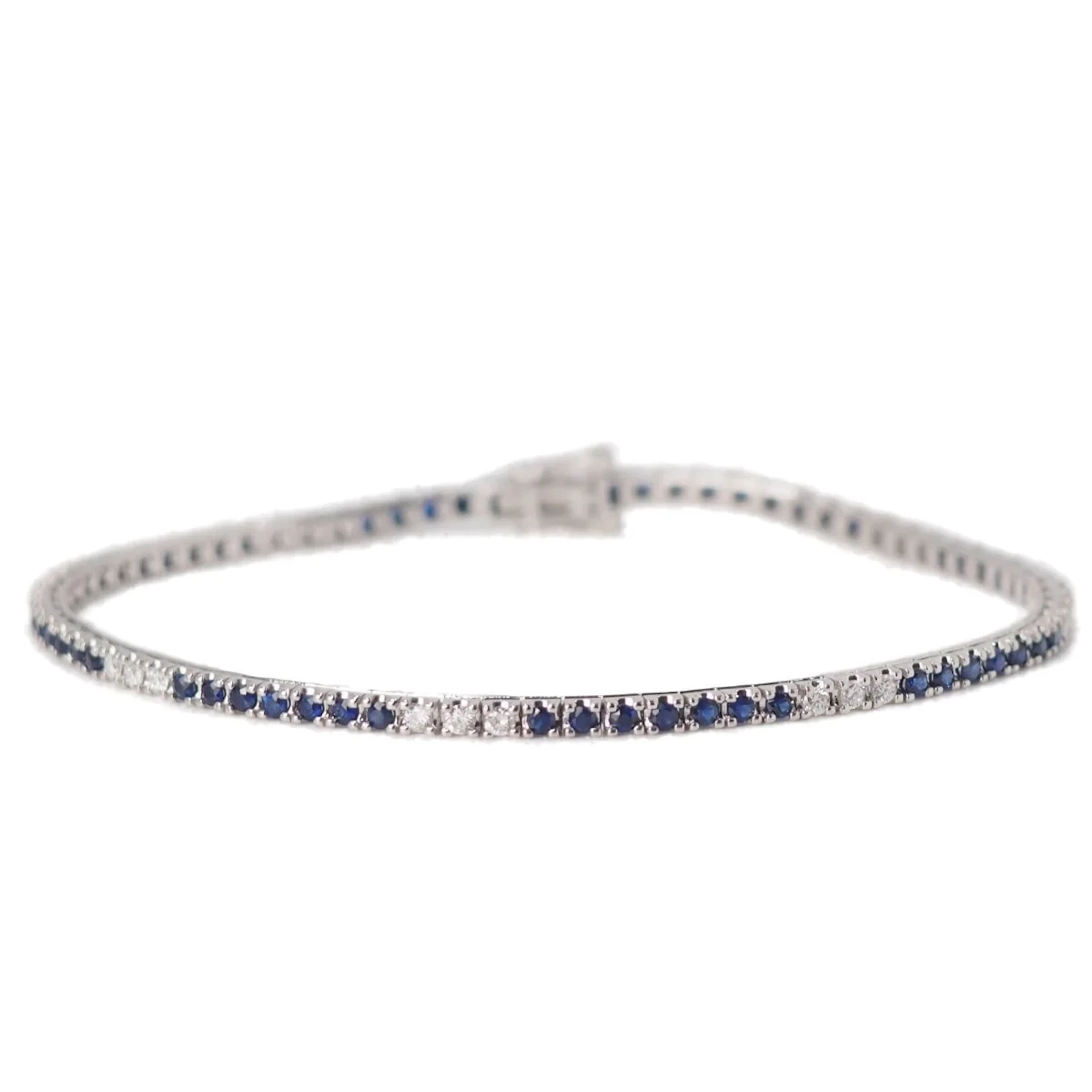 Ligne bracelet in white gold, sapphires and diamonds