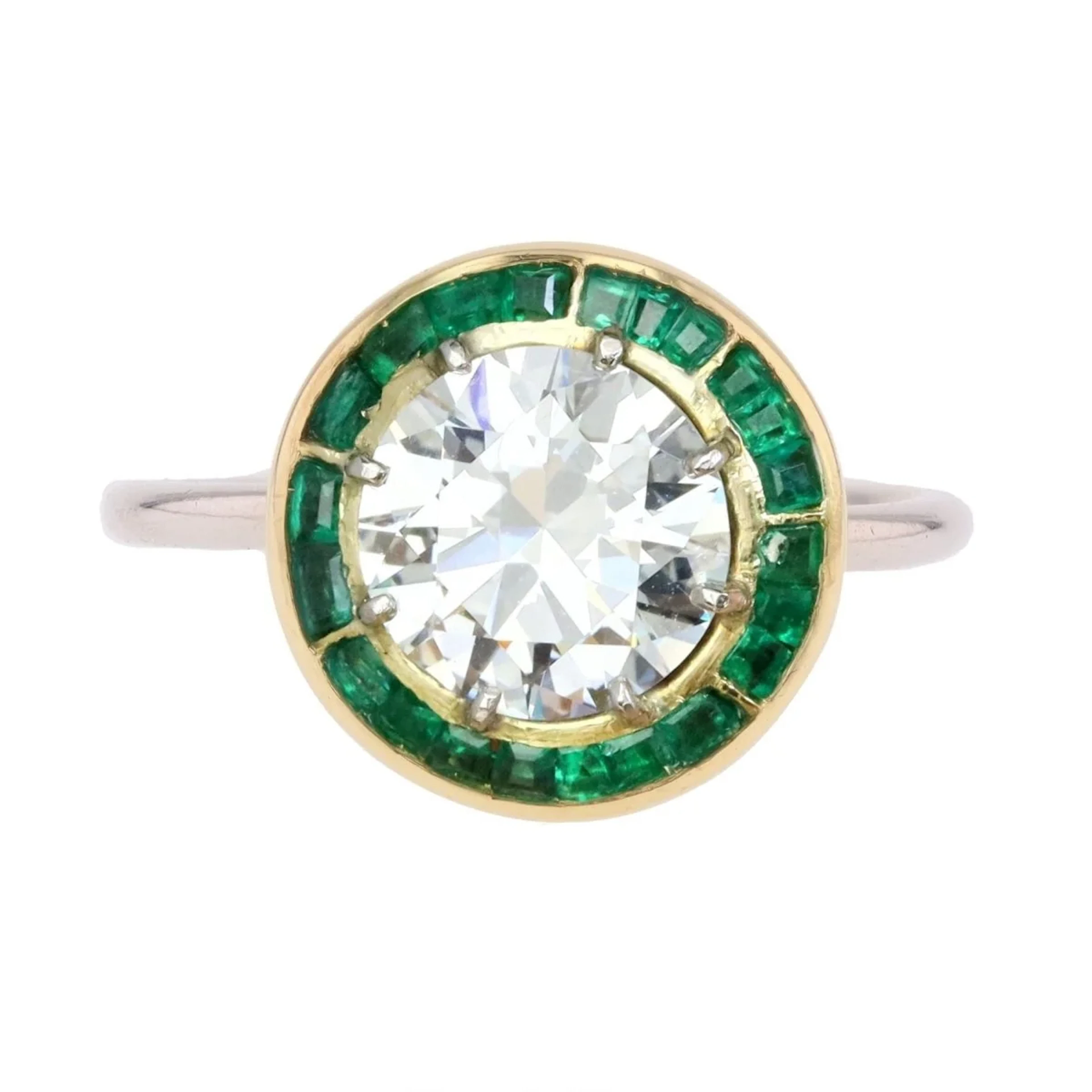 Entourage Ring in white gold, yellow gold, emeralds, and diamonds
