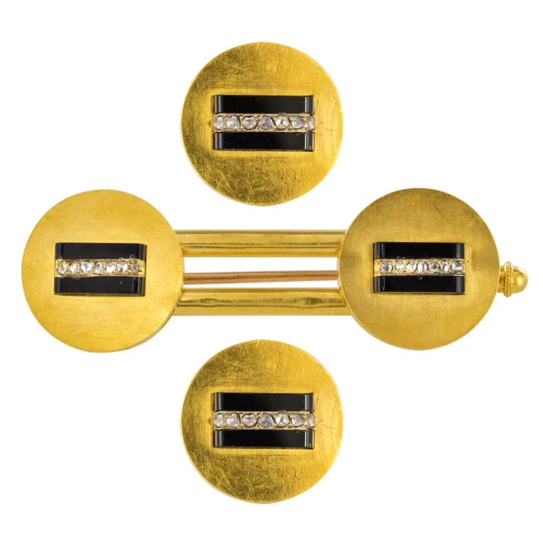 Set in yellow gold, onyx and diamonds