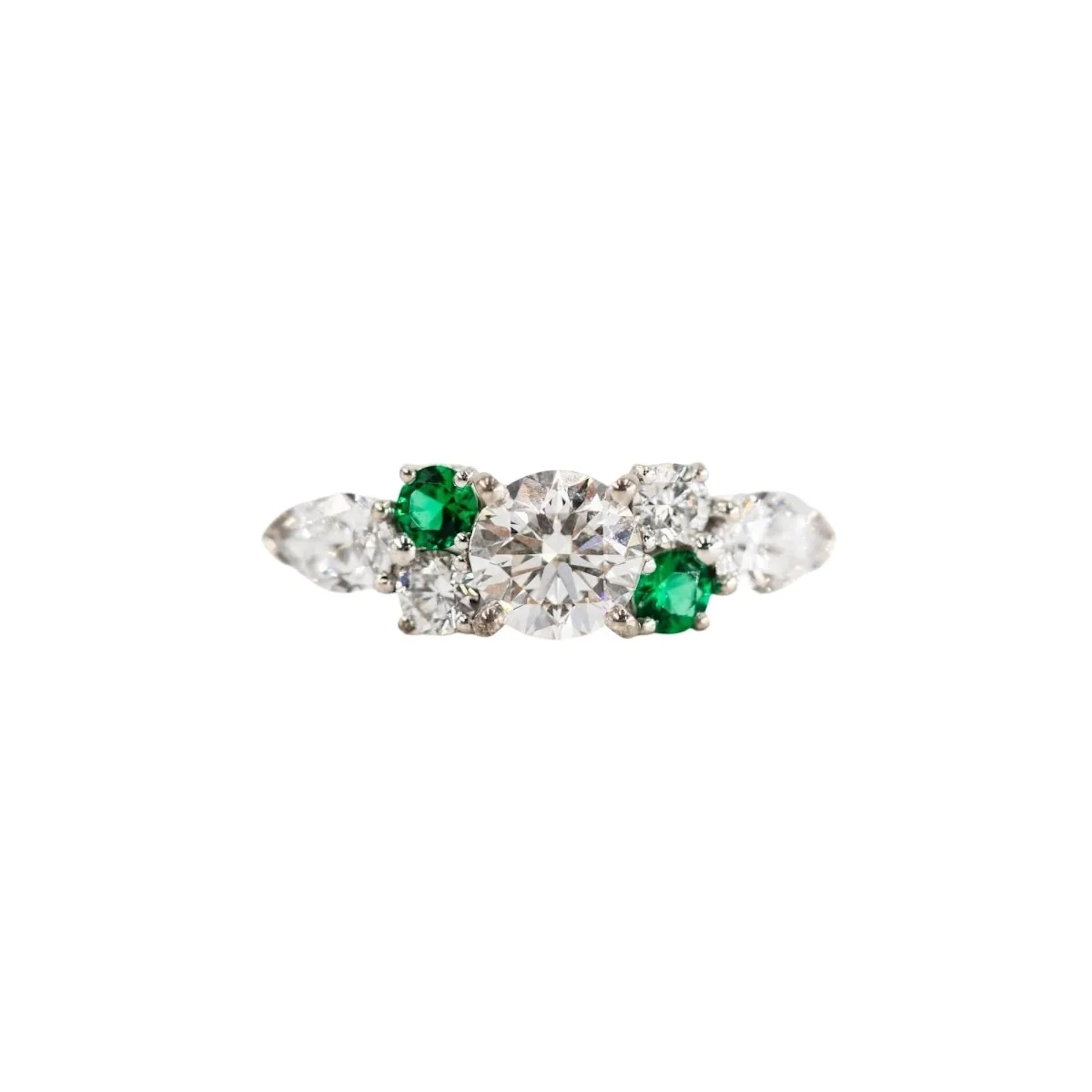 Entourage Ring in white gold, emeralds, and diamonds