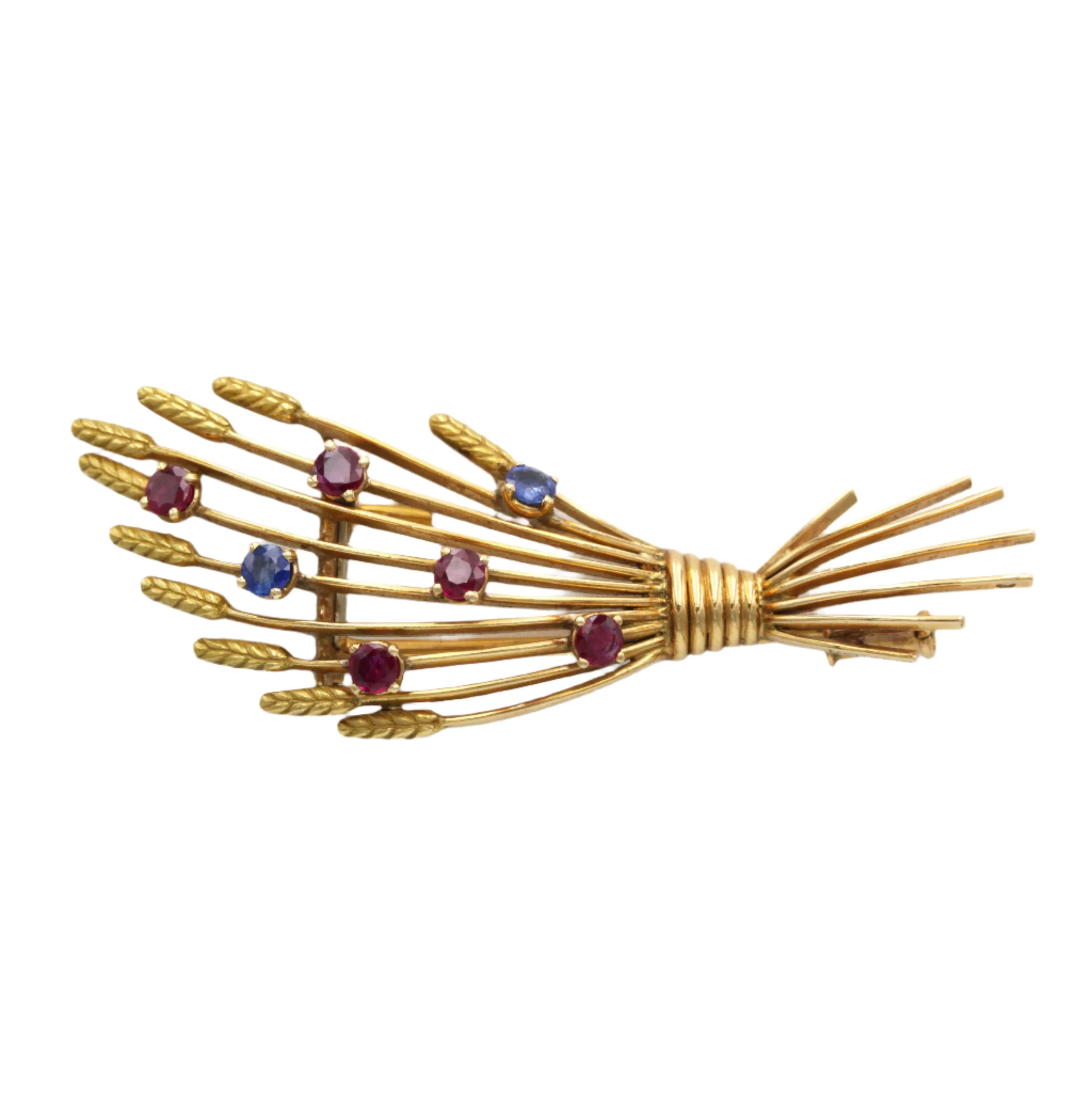 MELLERIO clip brooch in yellow gold, rubies, and sapphires