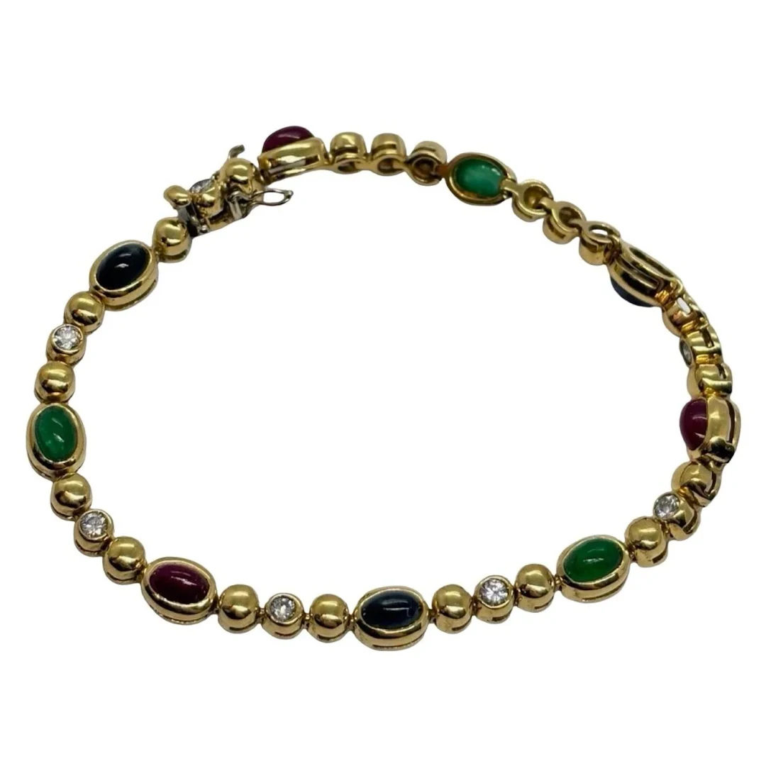 Bracelet Ligne en or jaune, saphirs, émeraudes, rubis et diamants