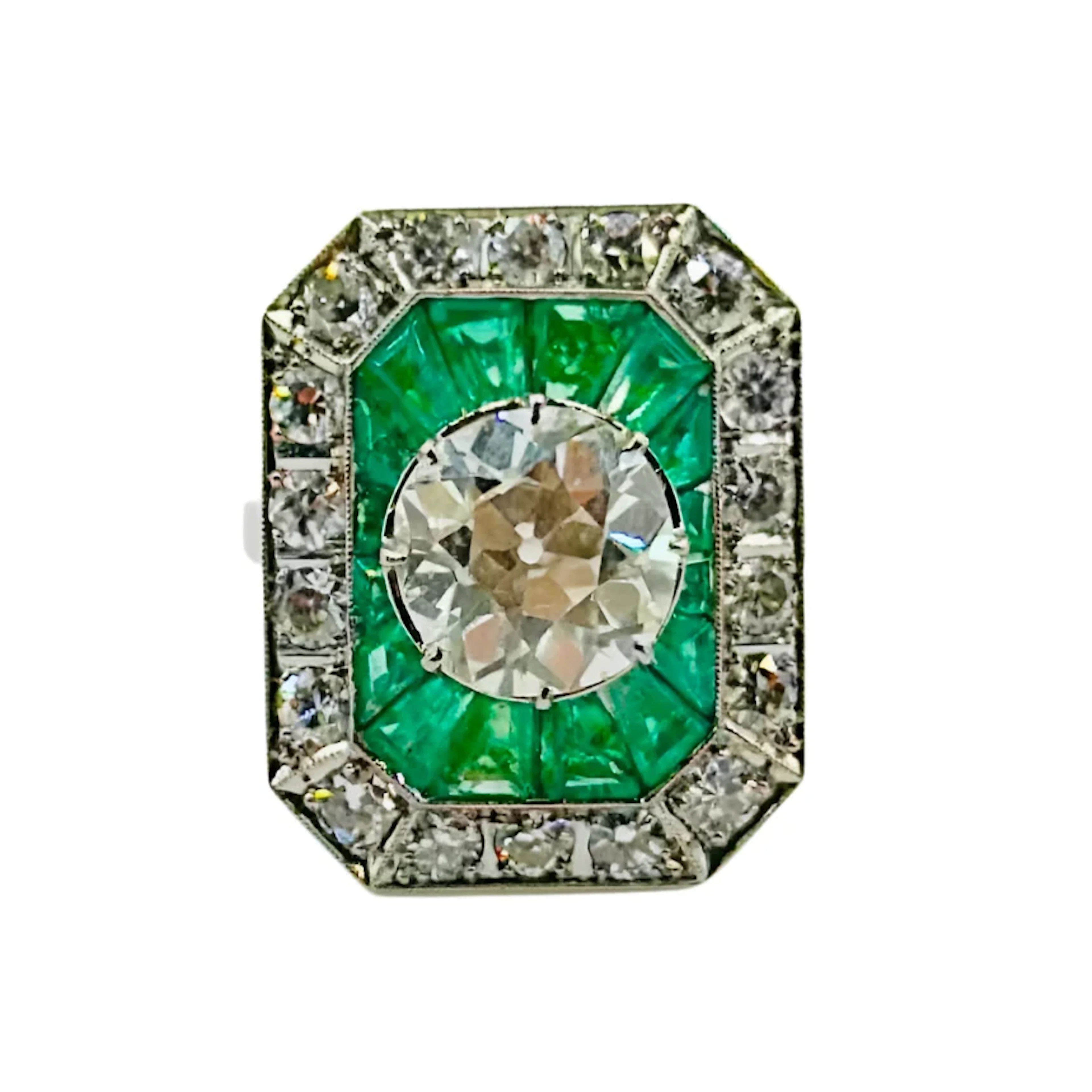 Bague en platine, diamant et émeraudes