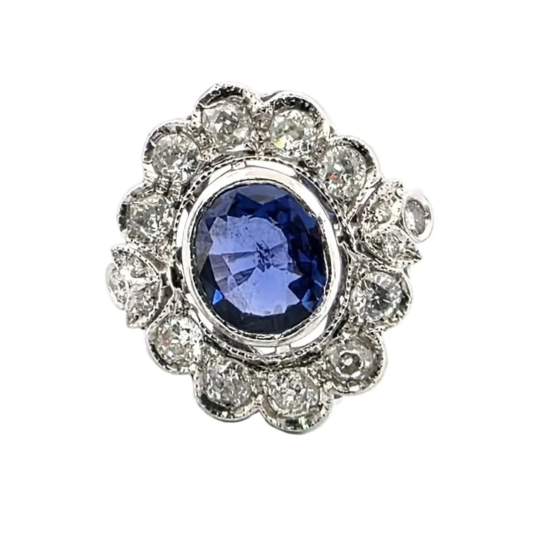 Bague Entourage en or blanc, saphir et diamants
