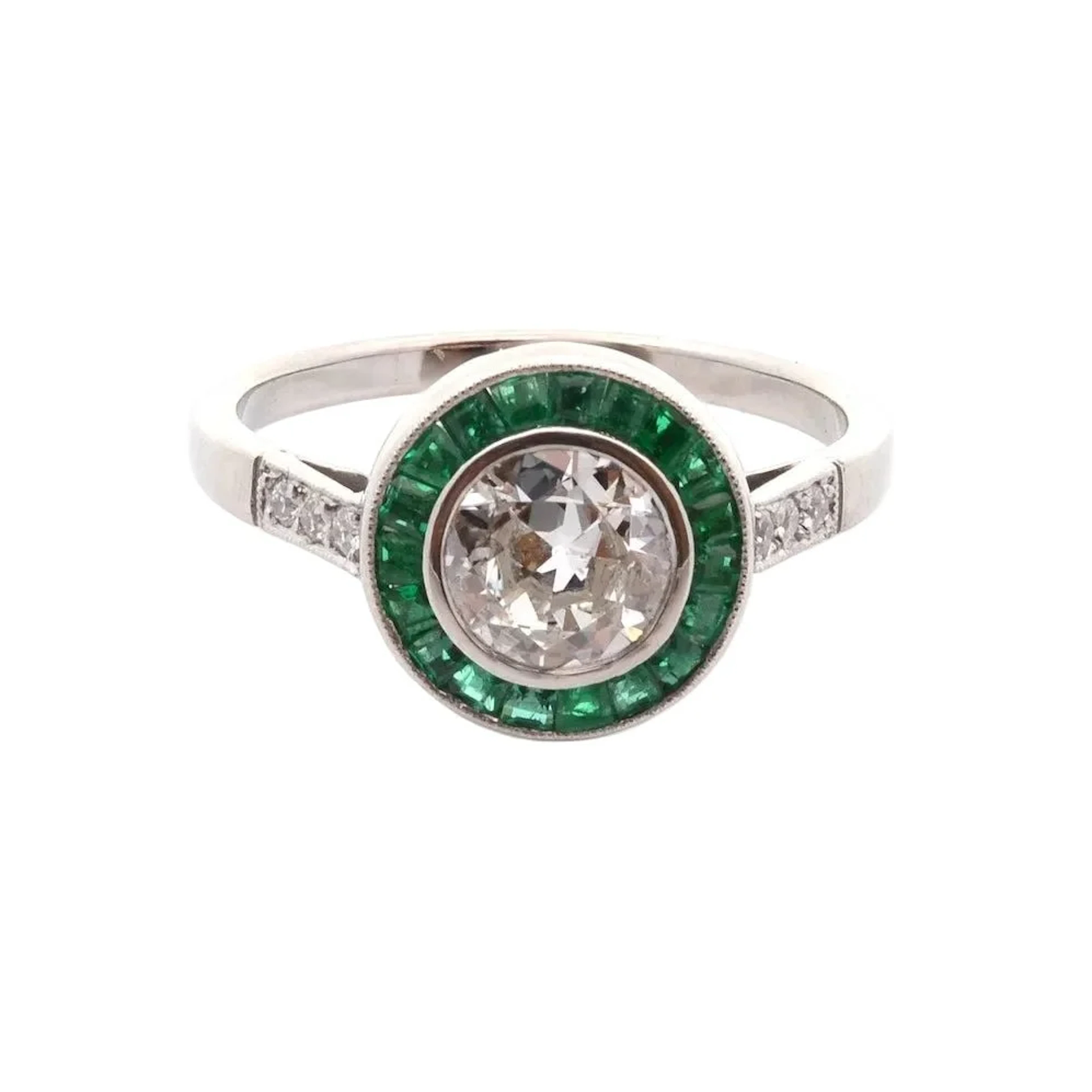 Platinum, emerald and diamond surround ring