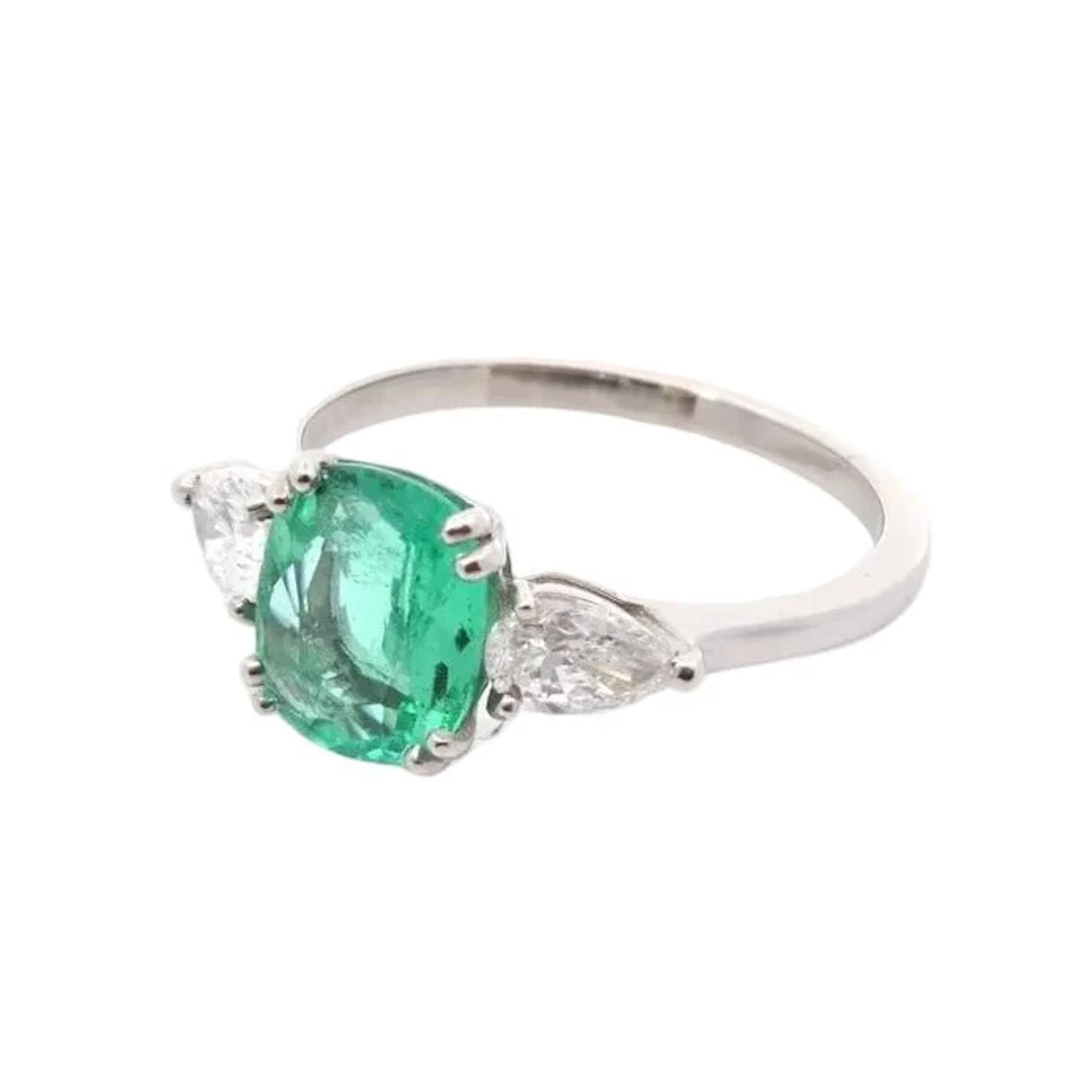 Trilogy Ring in Platinum, Emerald, and Diamonds