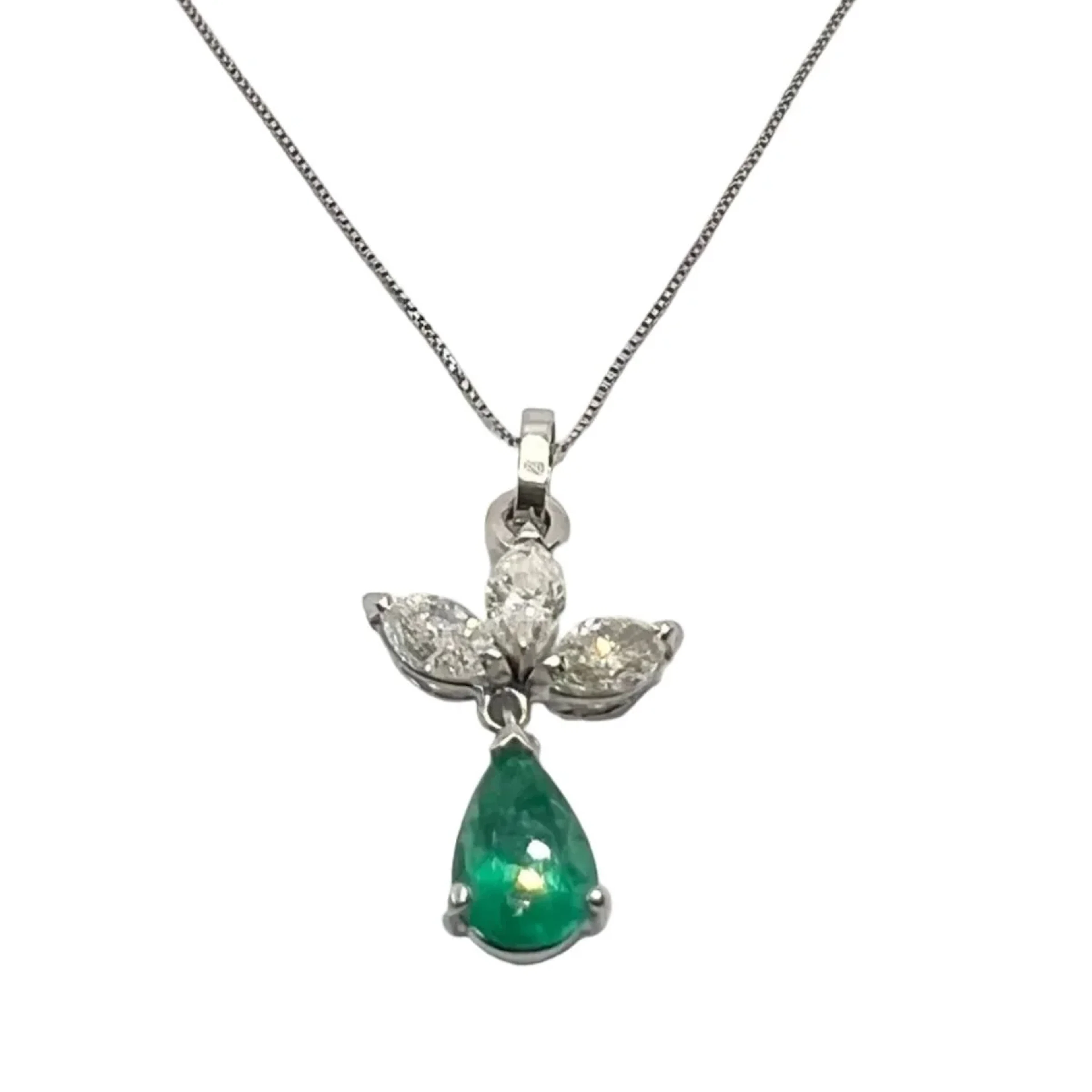 White gold, emerald, and diamond pendant