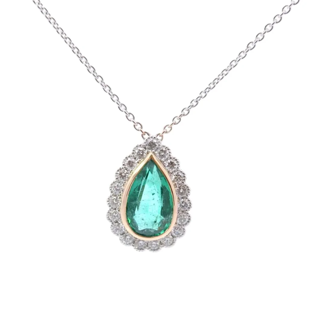 Necklace with a pendant in yellow gold, platinum, emerald, and diamonds