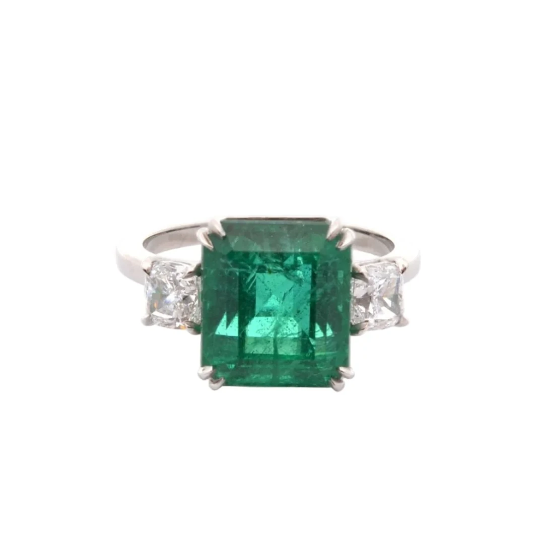 Trilogy ring in platinum, emeralds, and diamonds