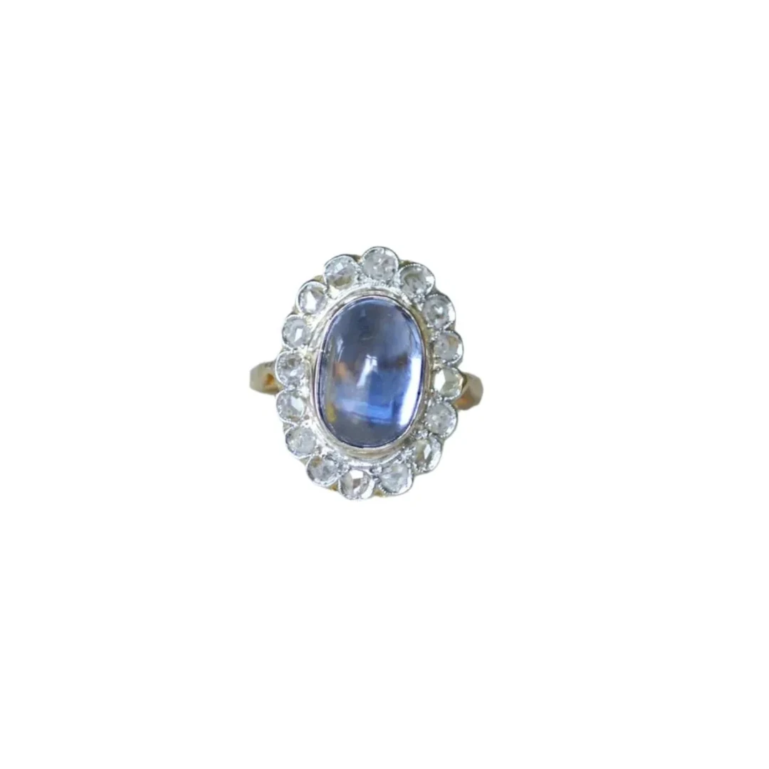 Marguerite ring in gold, platinum, sapphire and diamonds