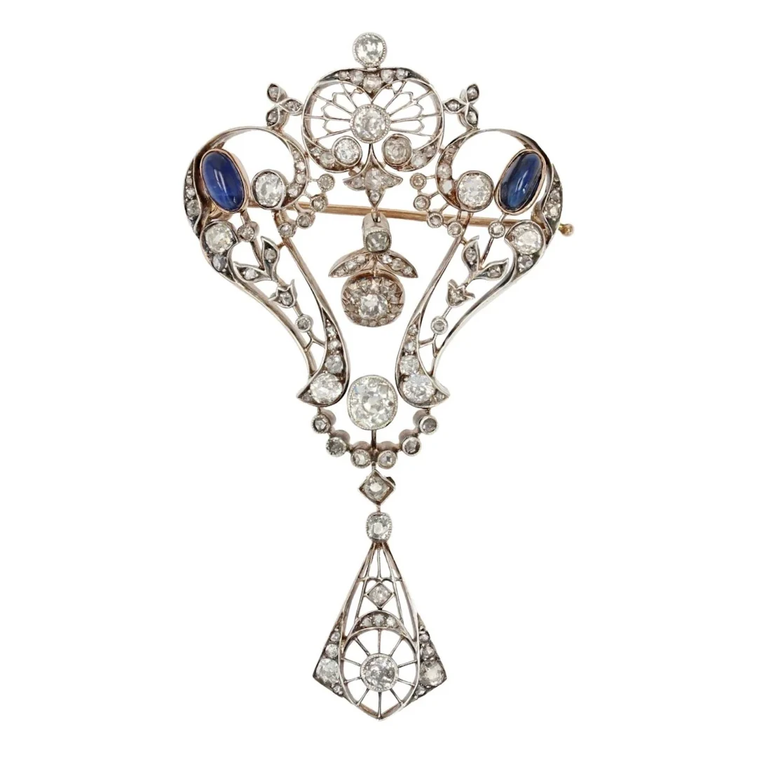 Broche Épingle en or rose, argent, saphirs et diamants