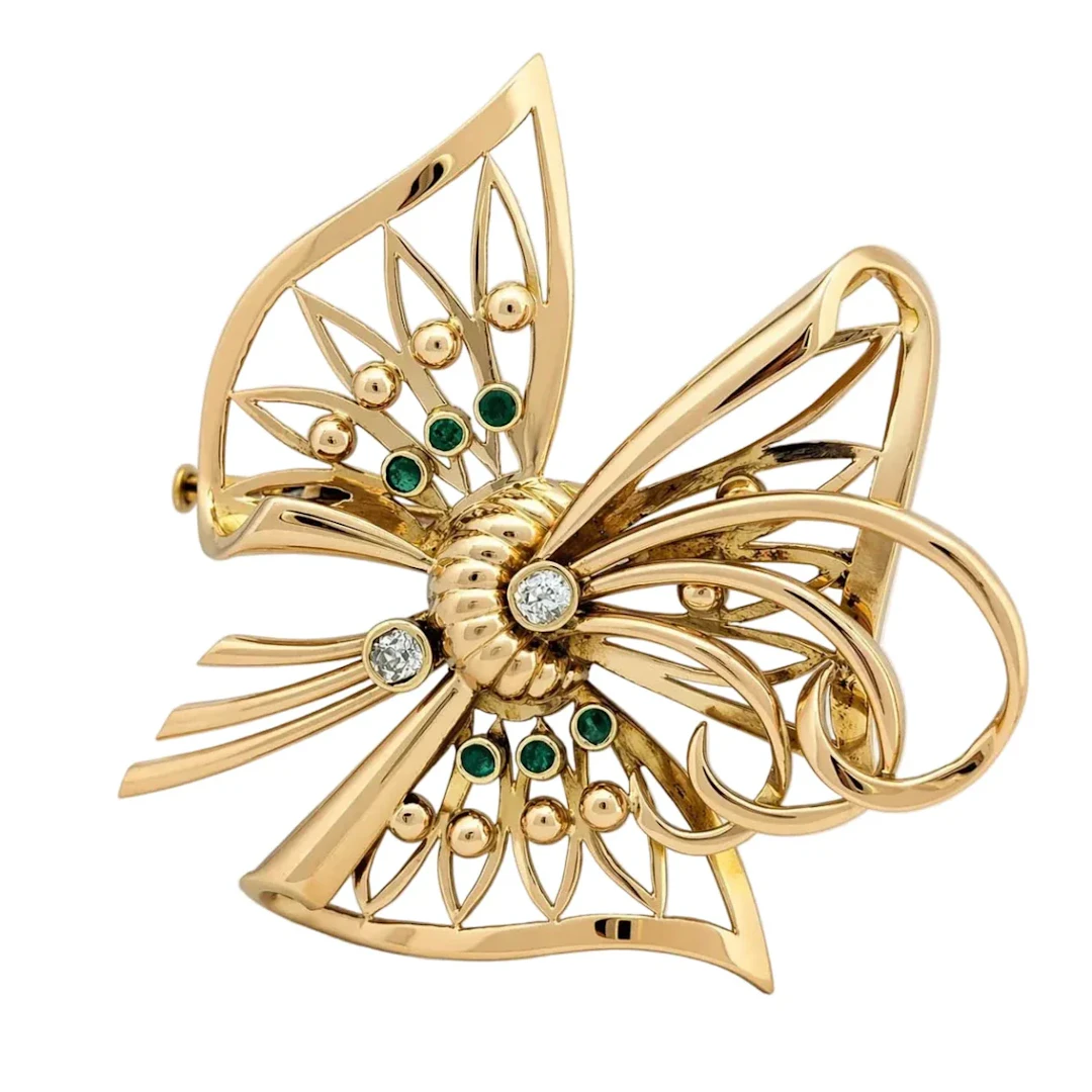 Yellow gold brooch with emeralds and diamonds