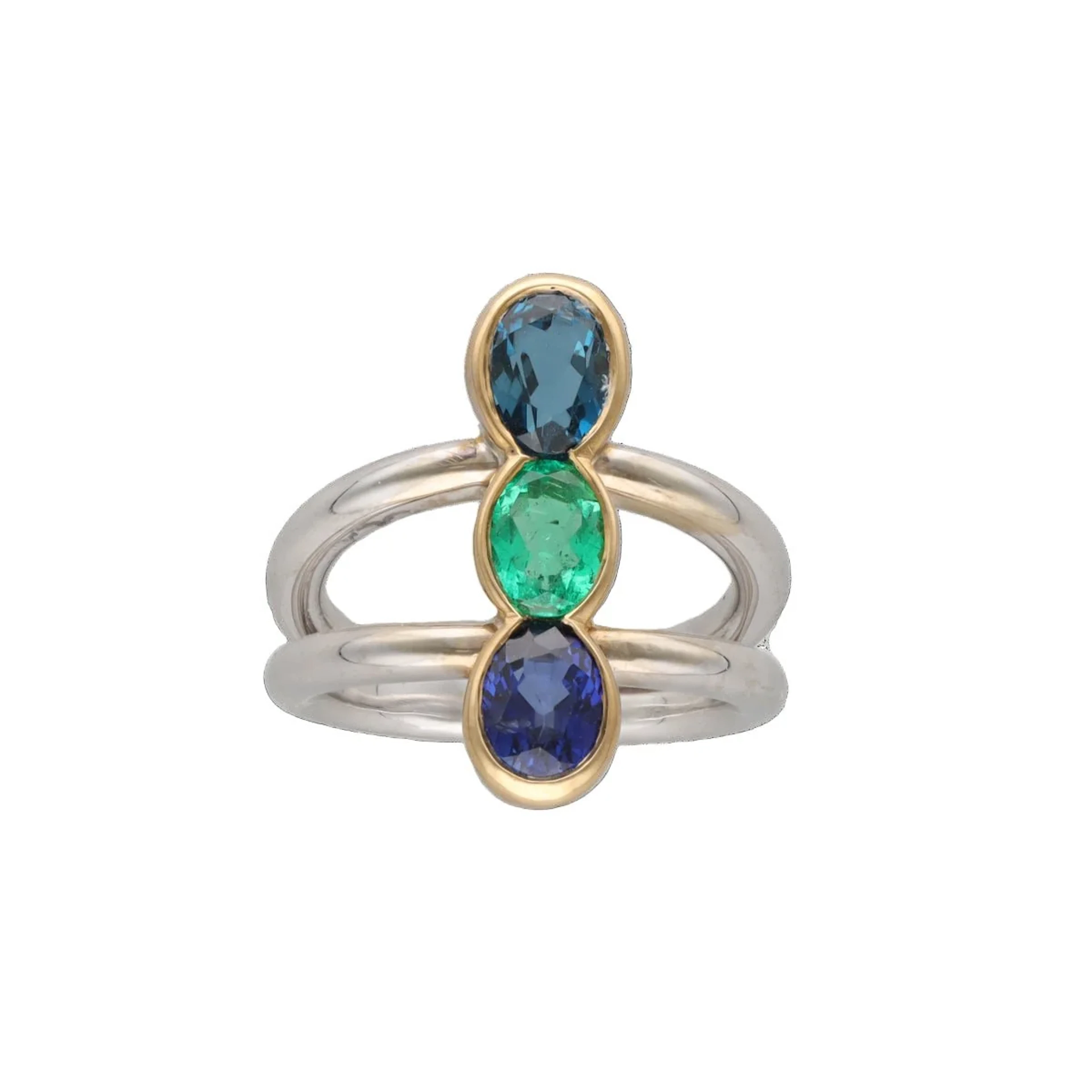 Trilogy ring in white gold, yellow gold, emerald, sapphire and topaz