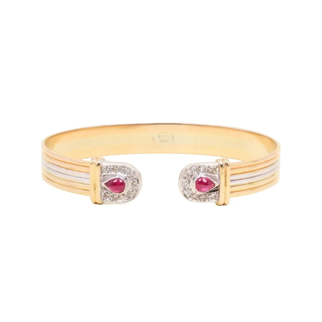 Bangle bracelet in white gold, yellow gold, rose gold, rubies, and diamonds