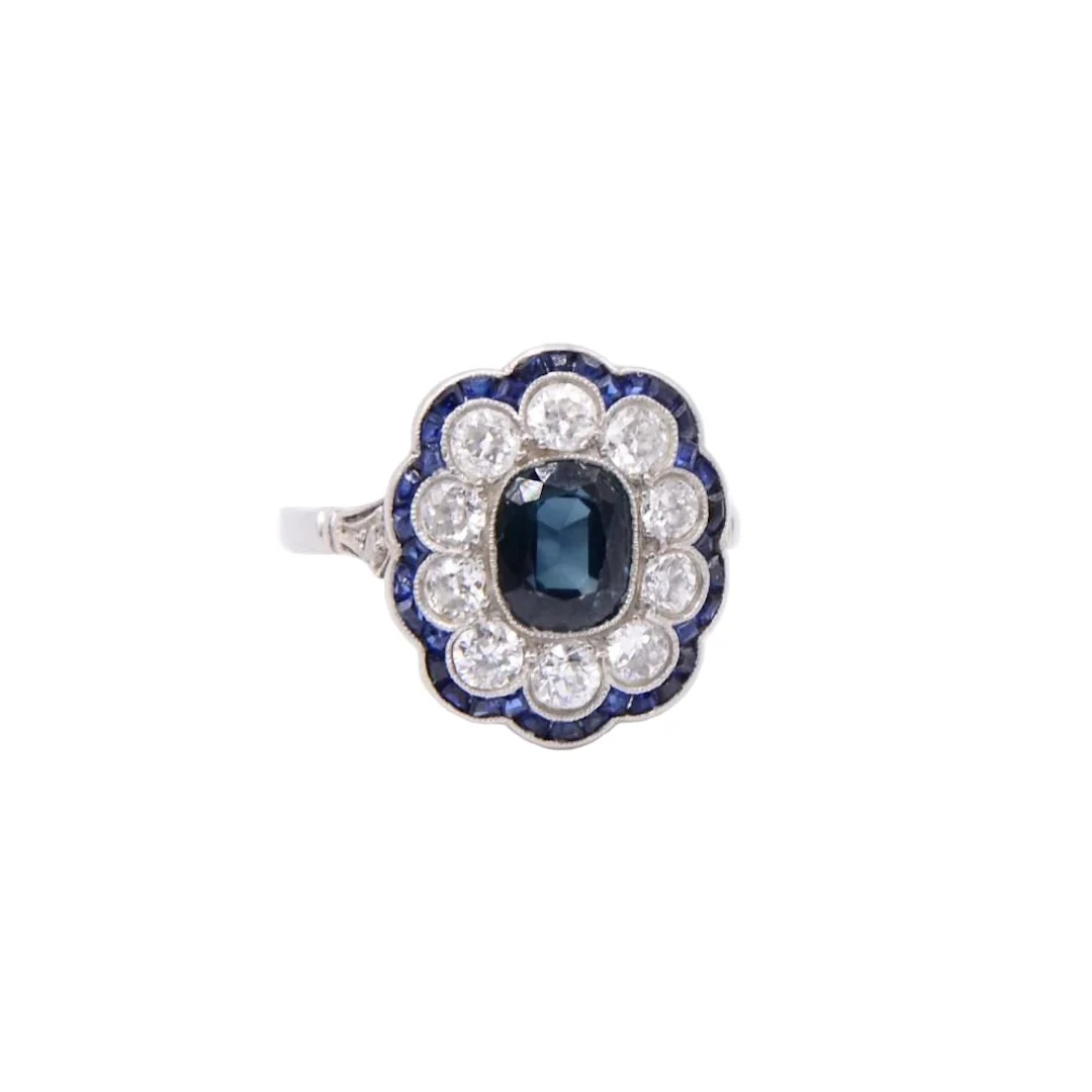 Entourage ring in platinum, sapphires and diamonds