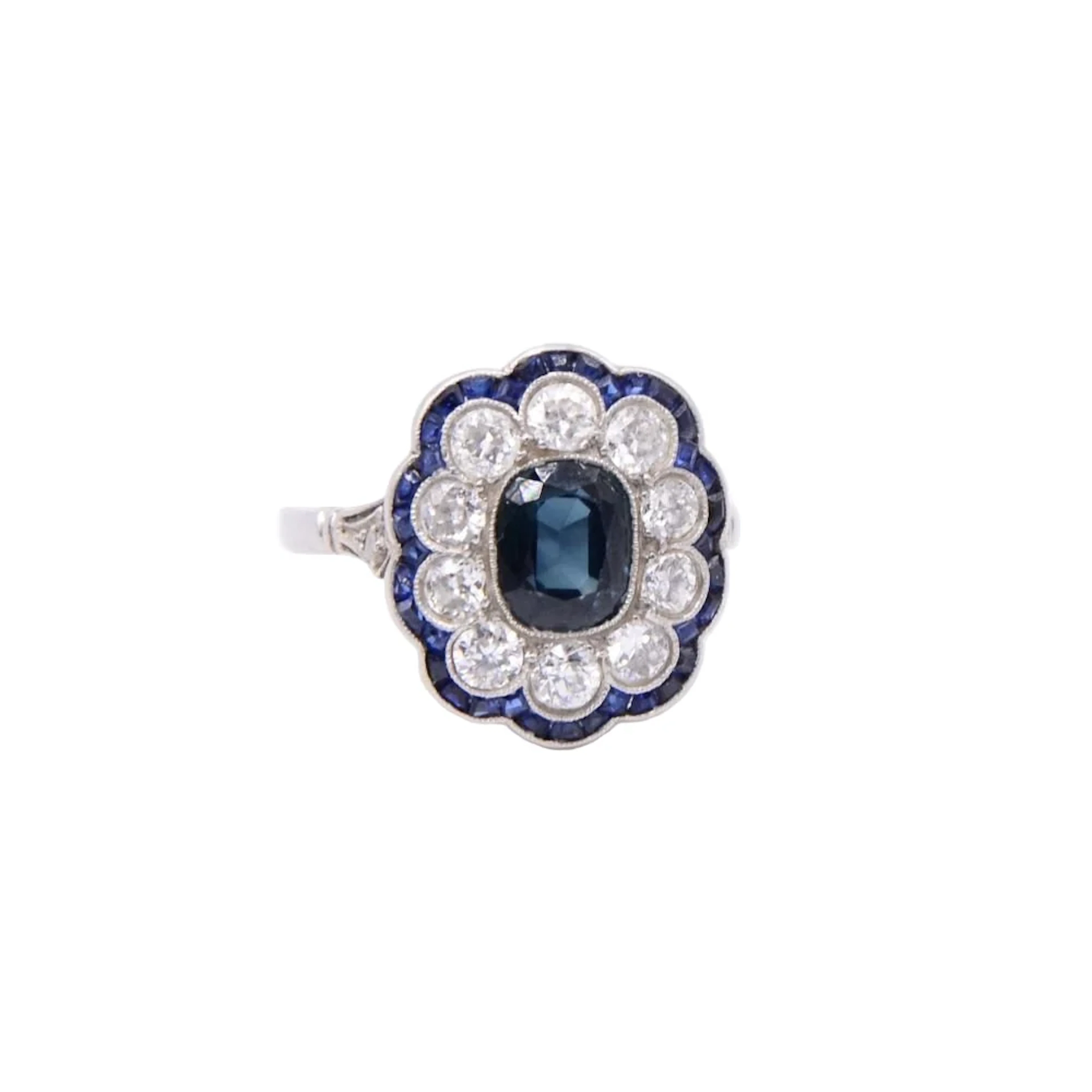 Entourage ring in platinum, sapphires and diamonds