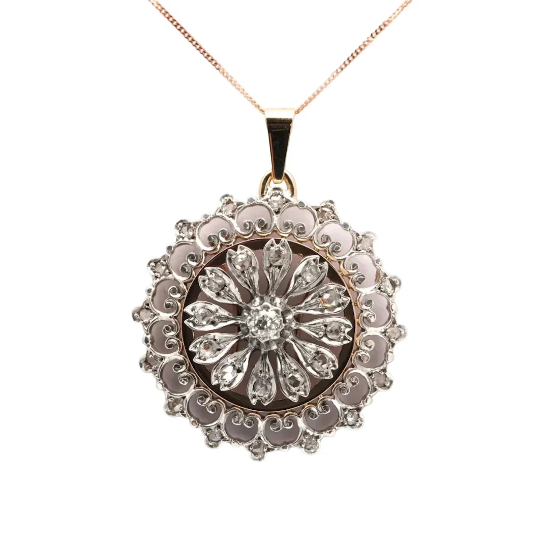 Yellow gold, silver, and diamond pendant